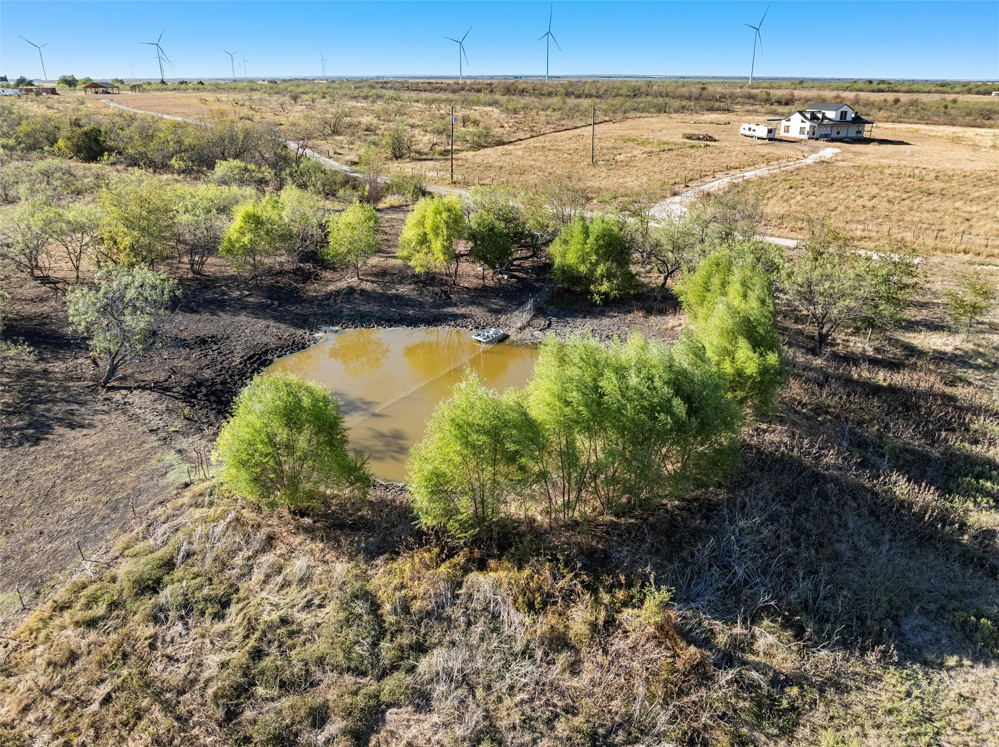 Aerial view featuring a rural view and a water view