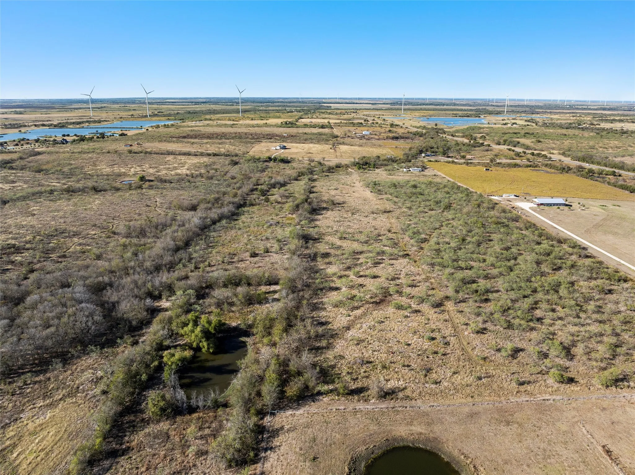 Aerial view with a water view and a rural view