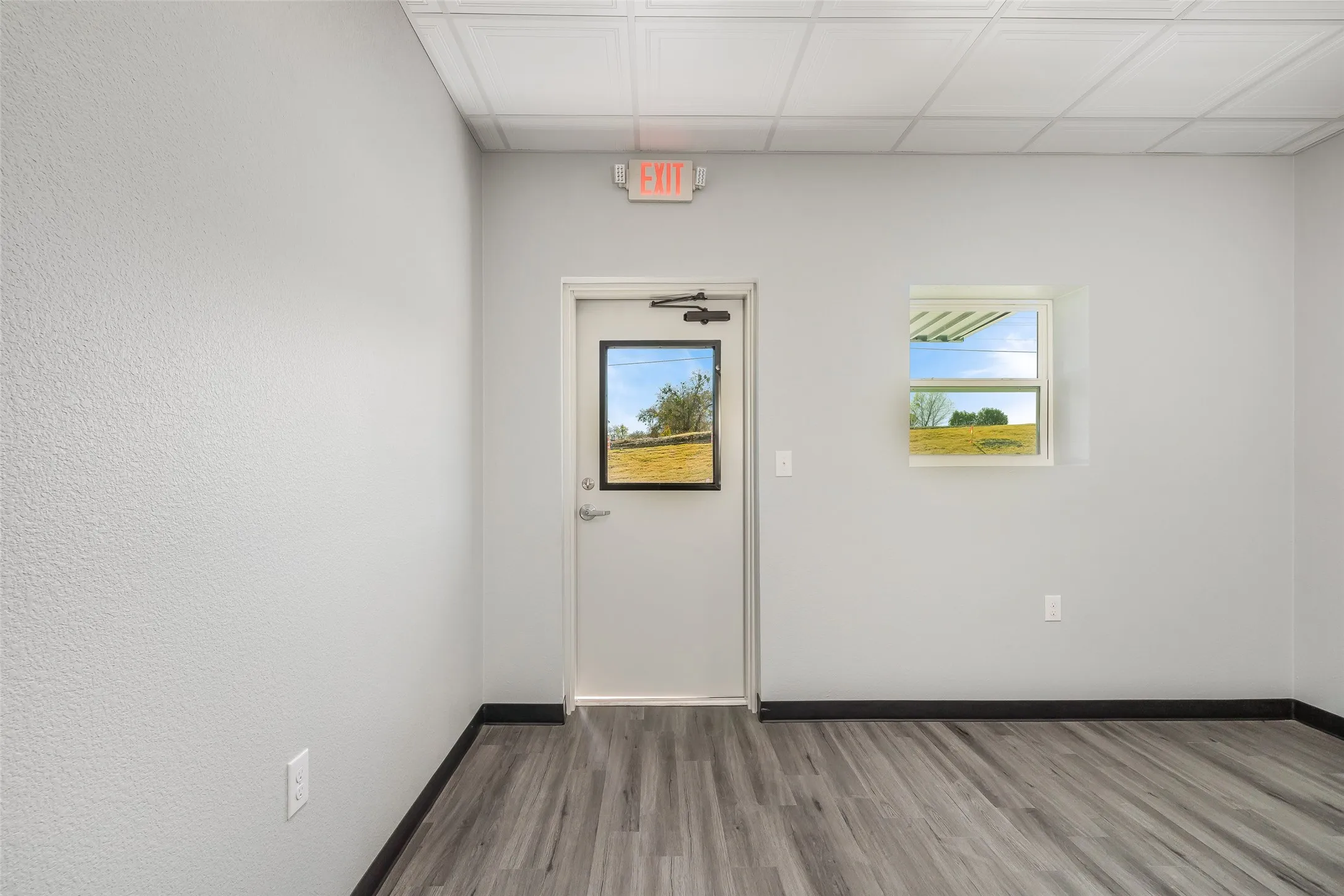 This is a view of the front office space included on all units! Office space is measured at 13' x 12.' (This is including the bathroom)