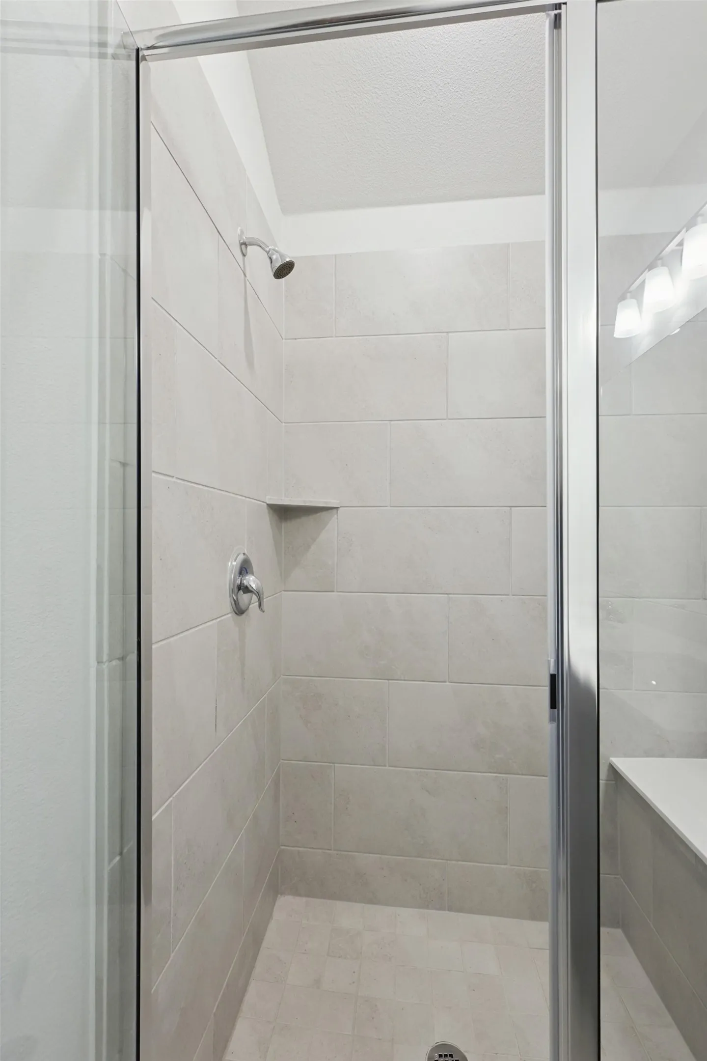 Bathroom featuring a shower with shower door