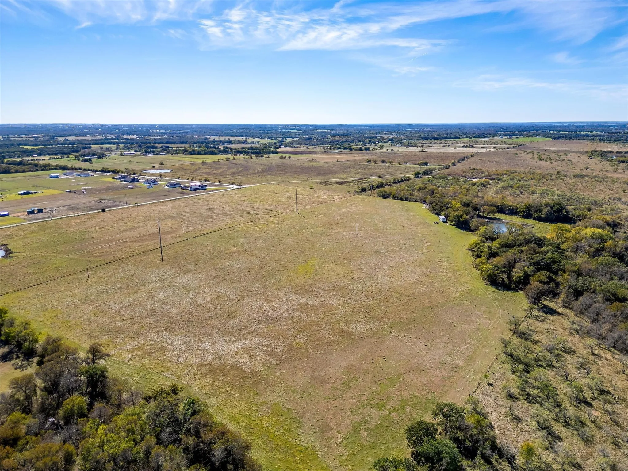 Birds eye view of property featuring a rural view
