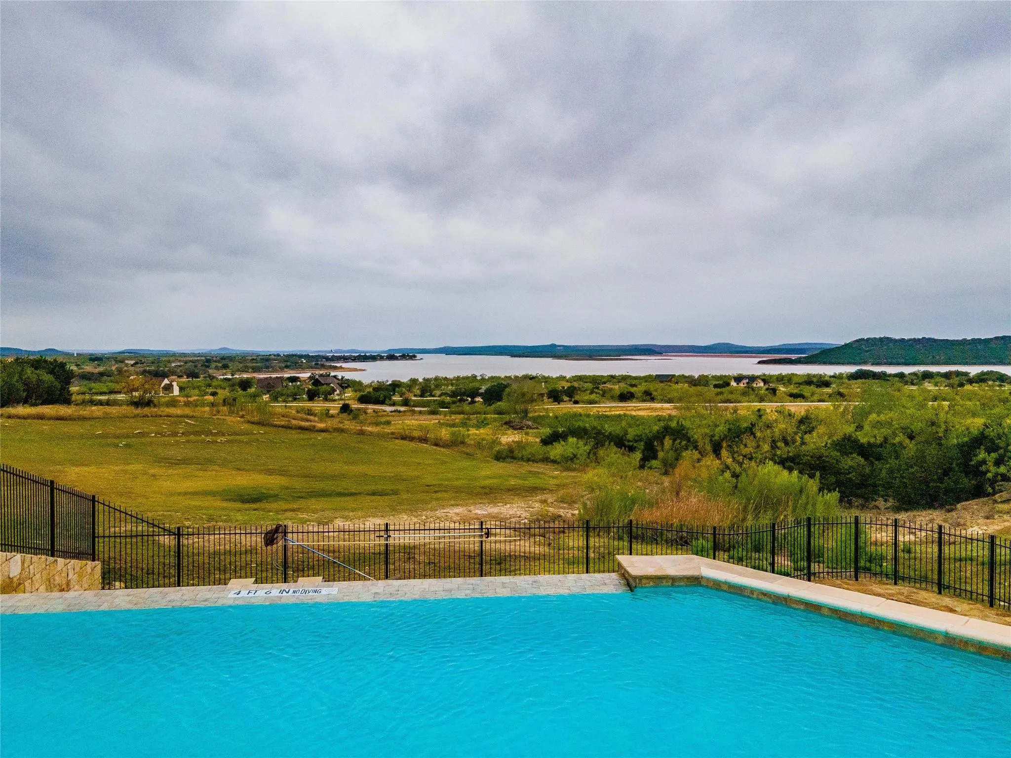 View of pool featuring a water and mountain view