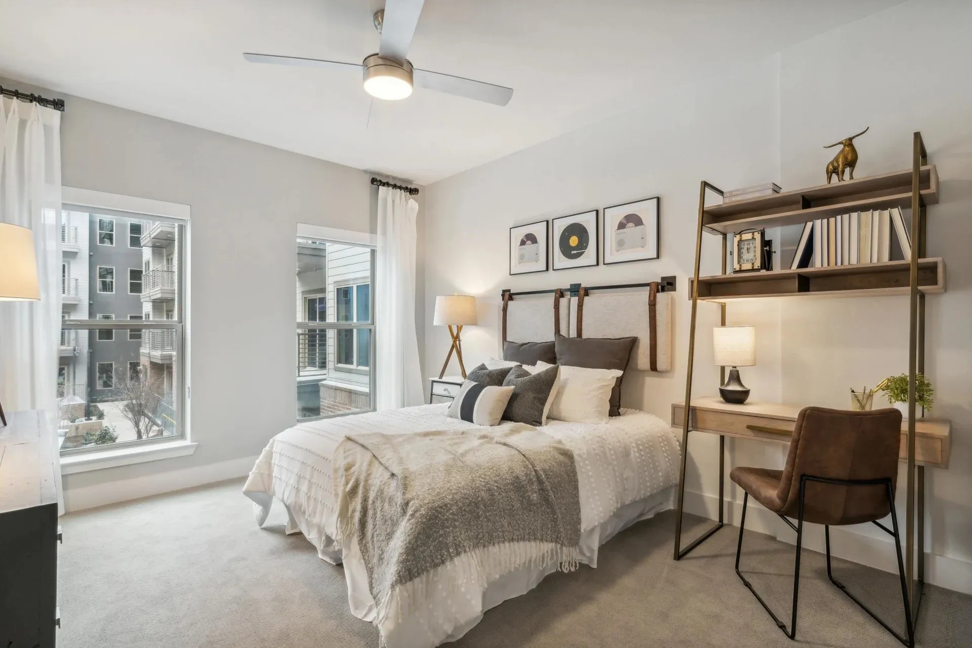 Bedroom featuring light colored carpet and ceiling fan