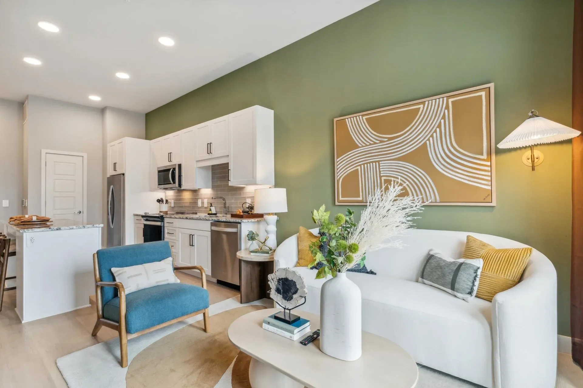 Living room with sink and light hardwood / wood-style flooring