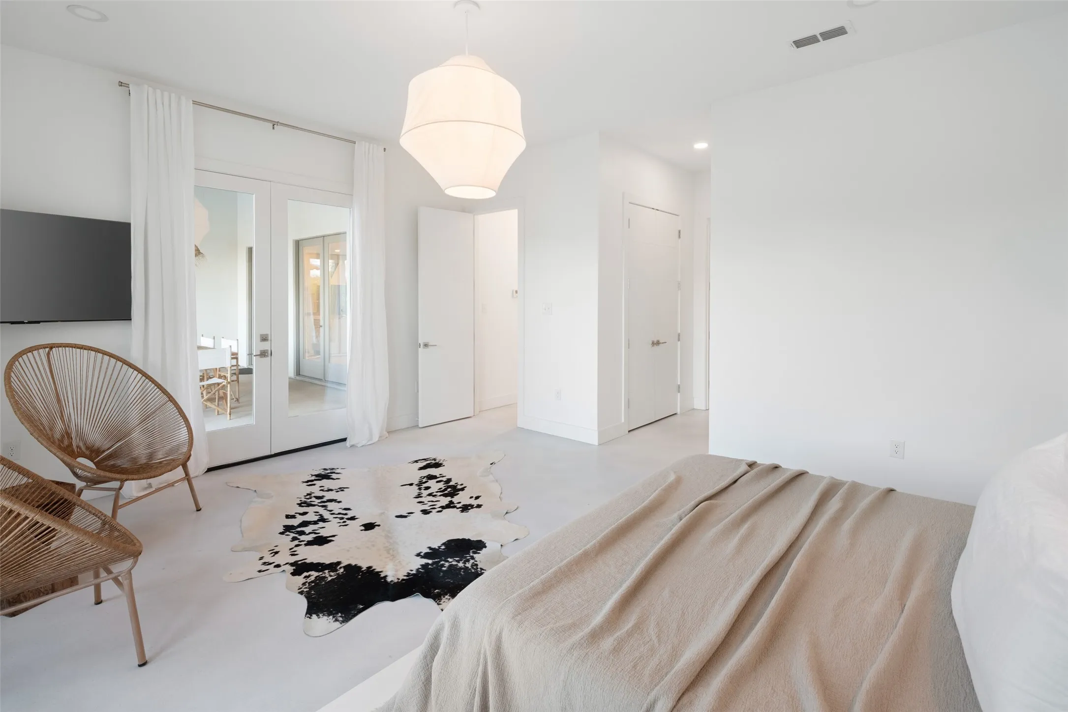 Bedroom featuring french doors