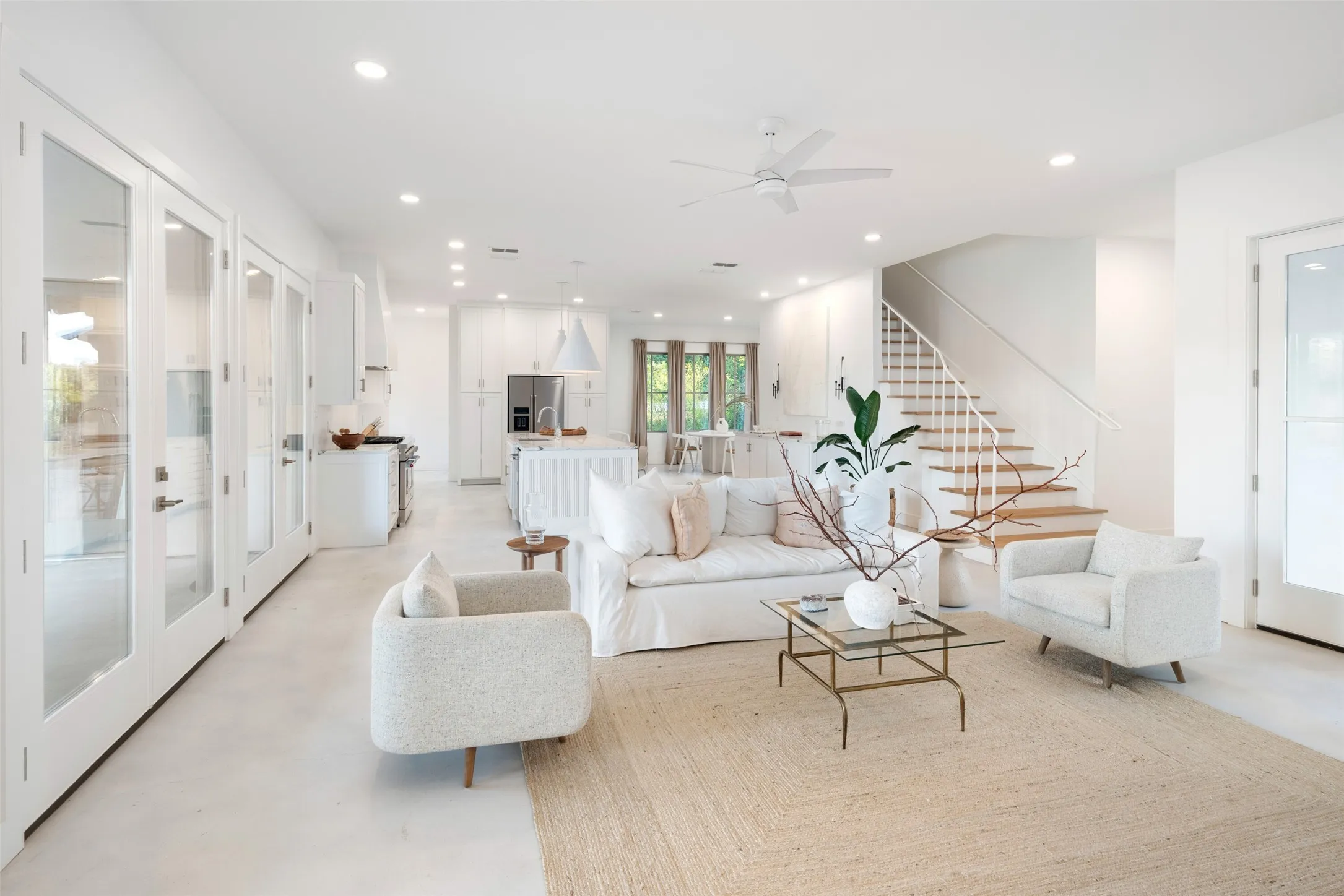 Living room featuring french doors and ceiling fan