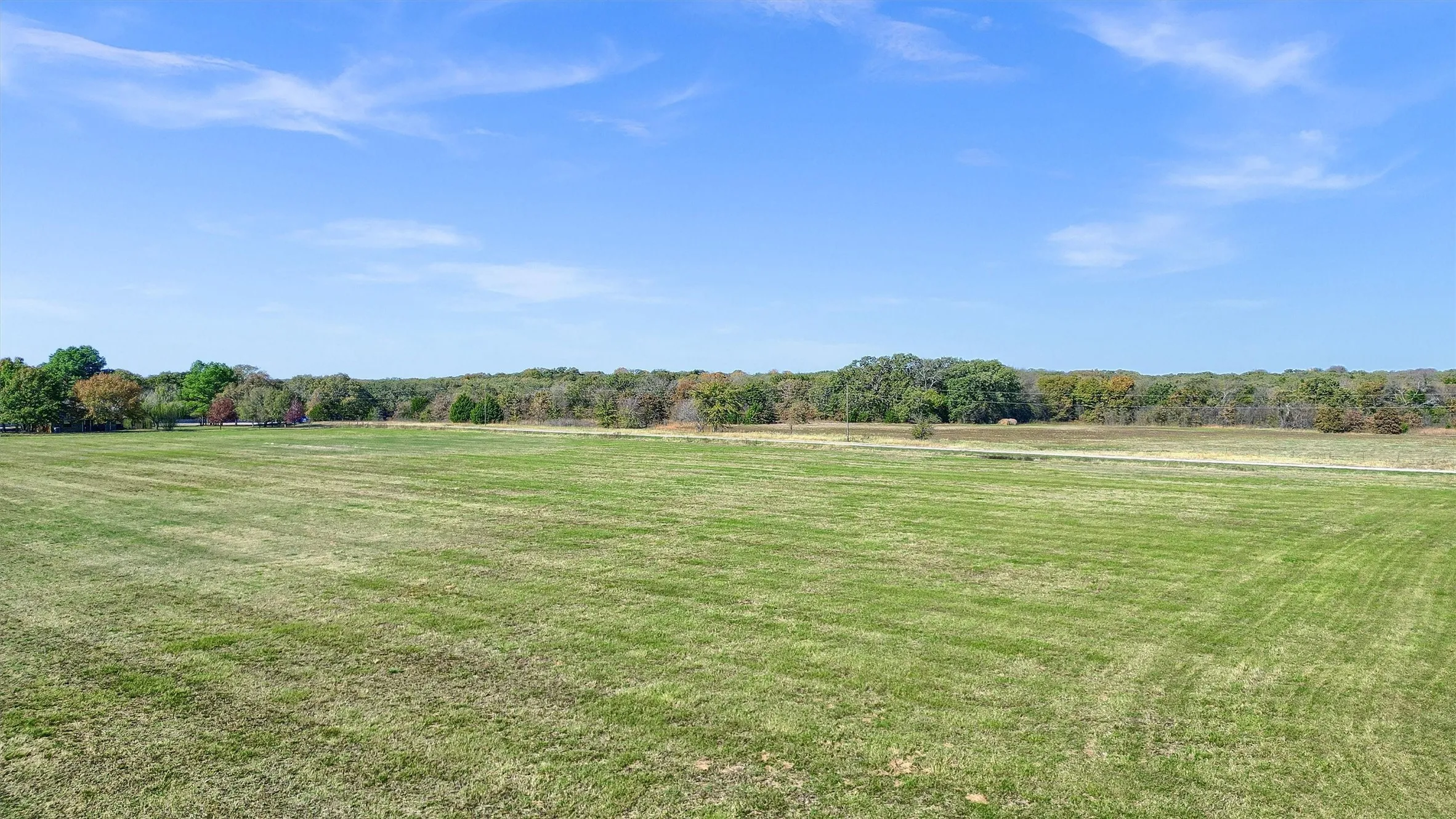 View of yard with a rural view
