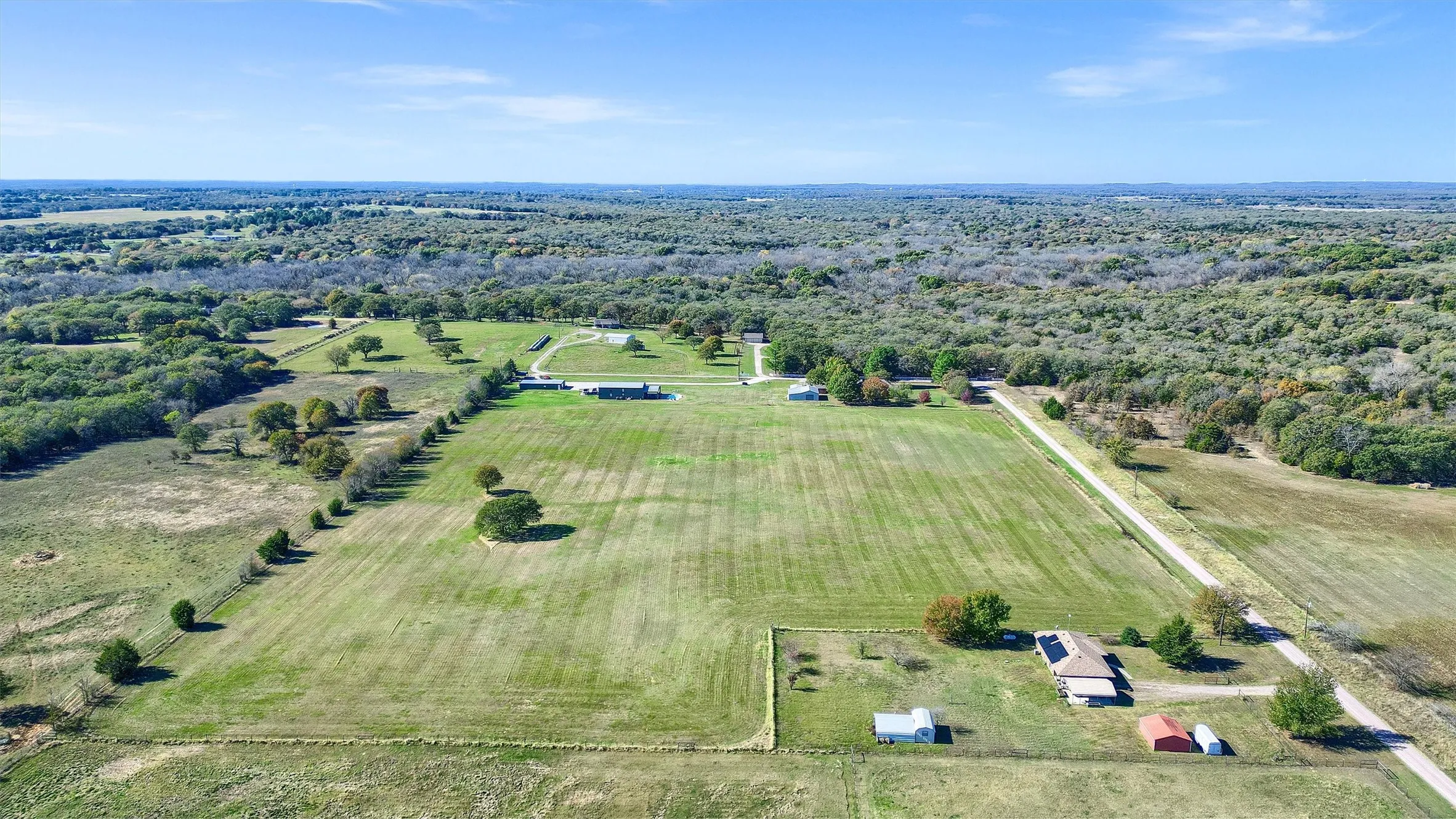 Birds eye view of property featuring a rural view