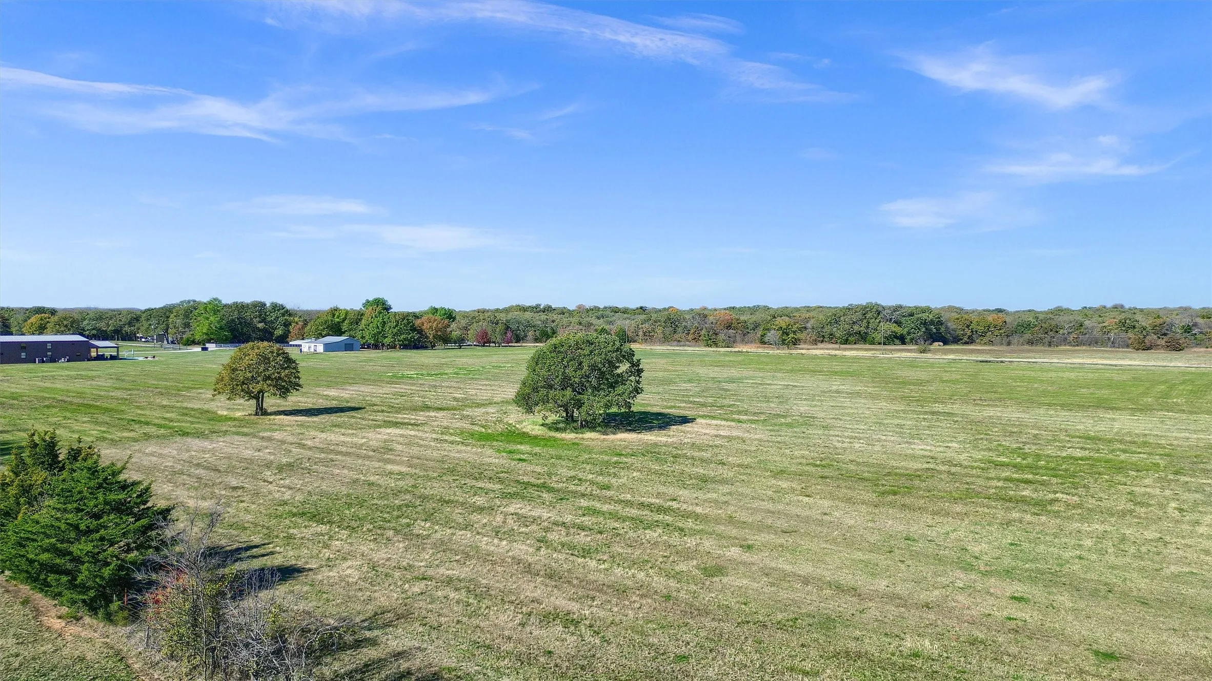 View of yard with a rural view