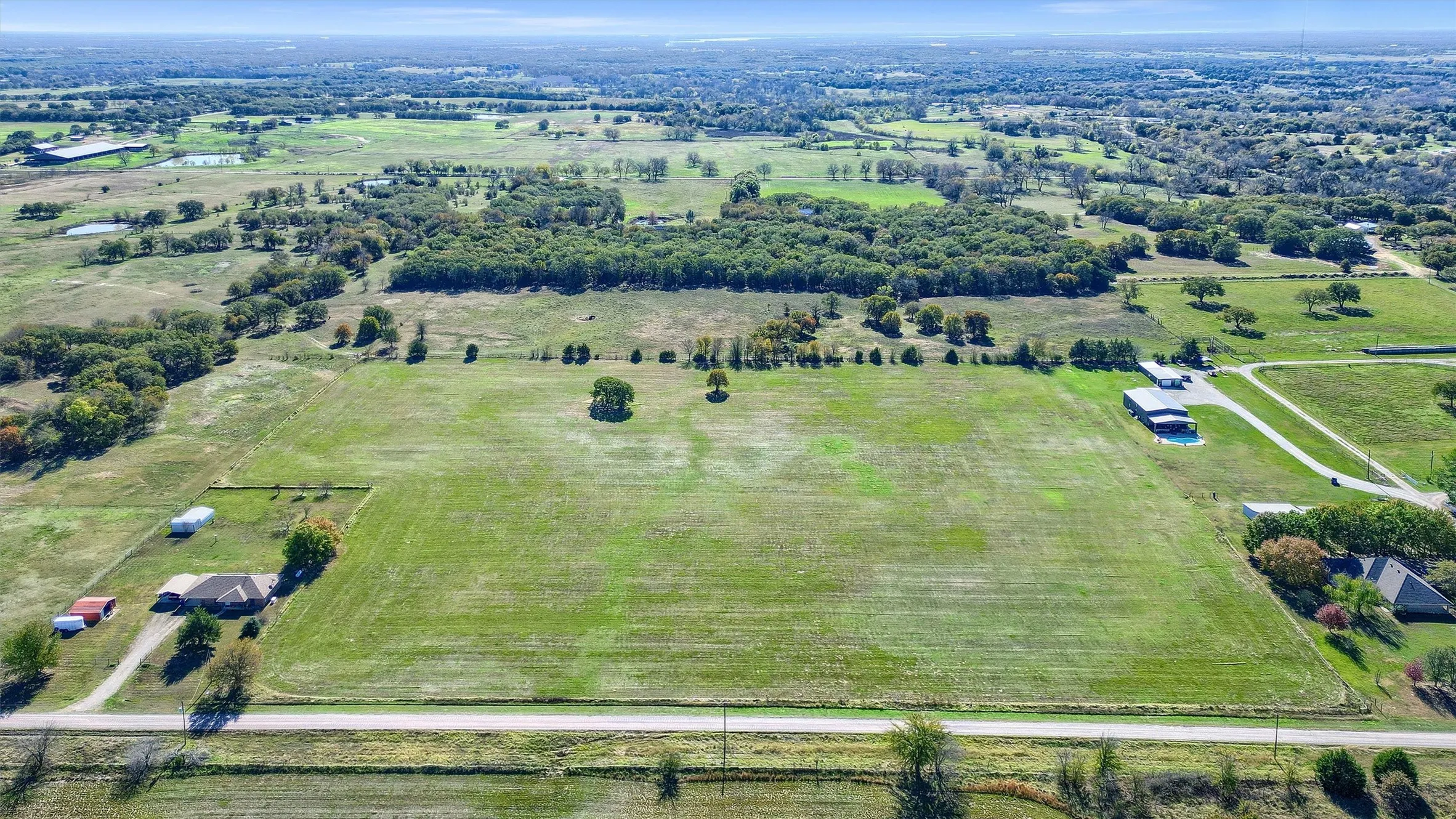 Birds eye view of property with a rural view
