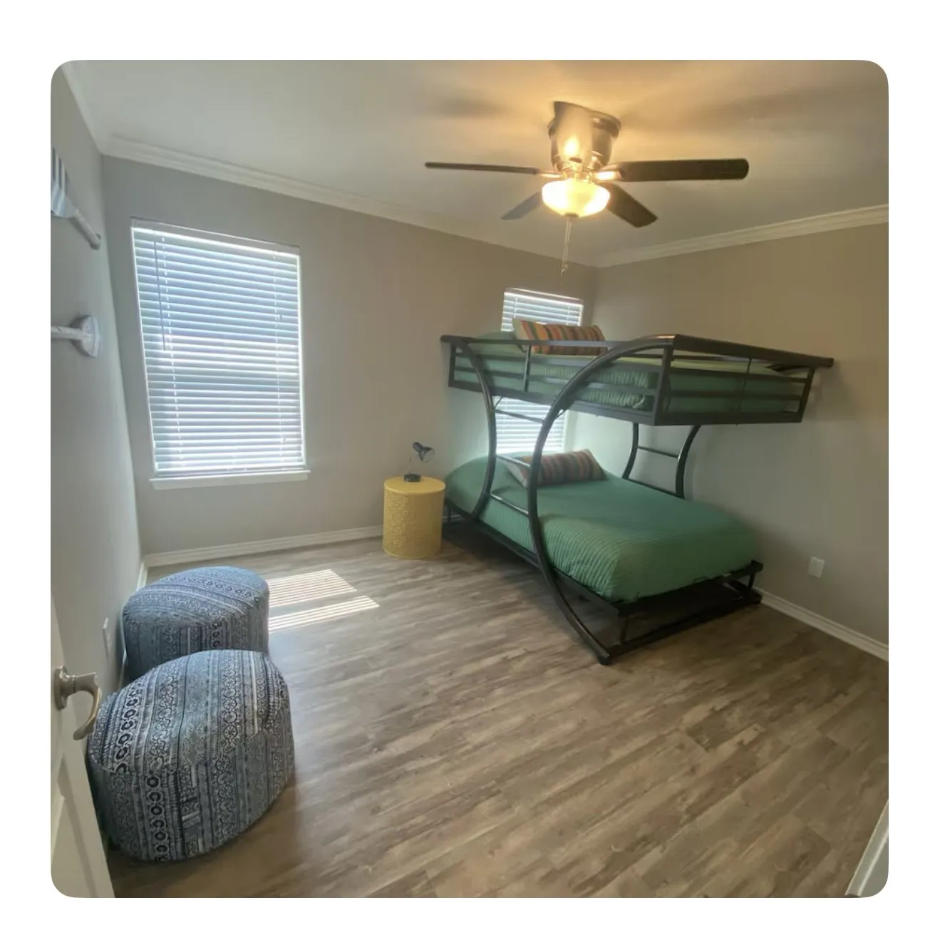 Bedroom with ceiling fan, crown molding, and hardwood / wood-style flooring