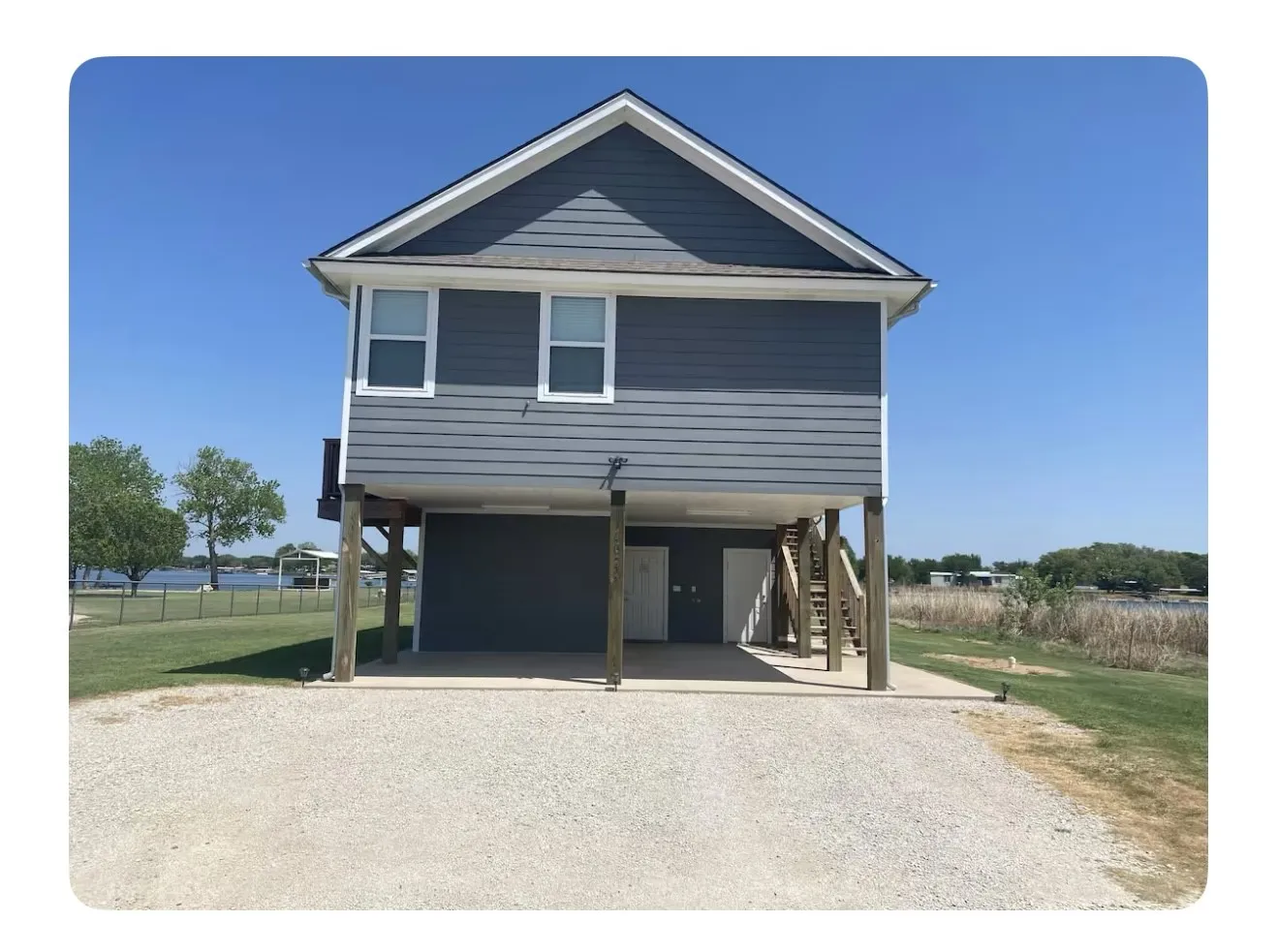 Coastal inspired home featuring a carport