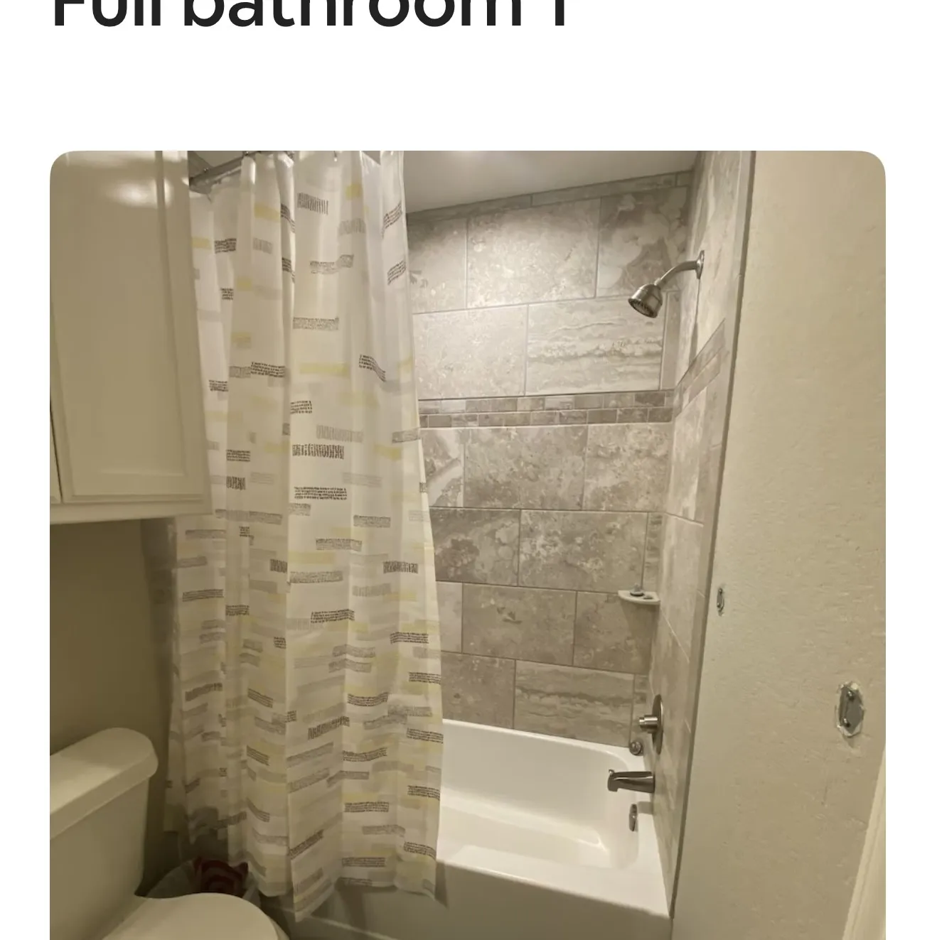 Bathroom featuring toilet and shower / tub combo