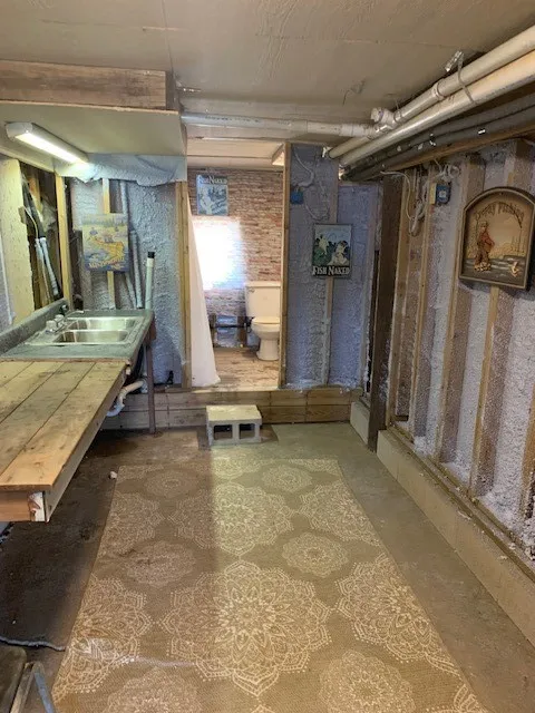 3rd full bath / storage area under house