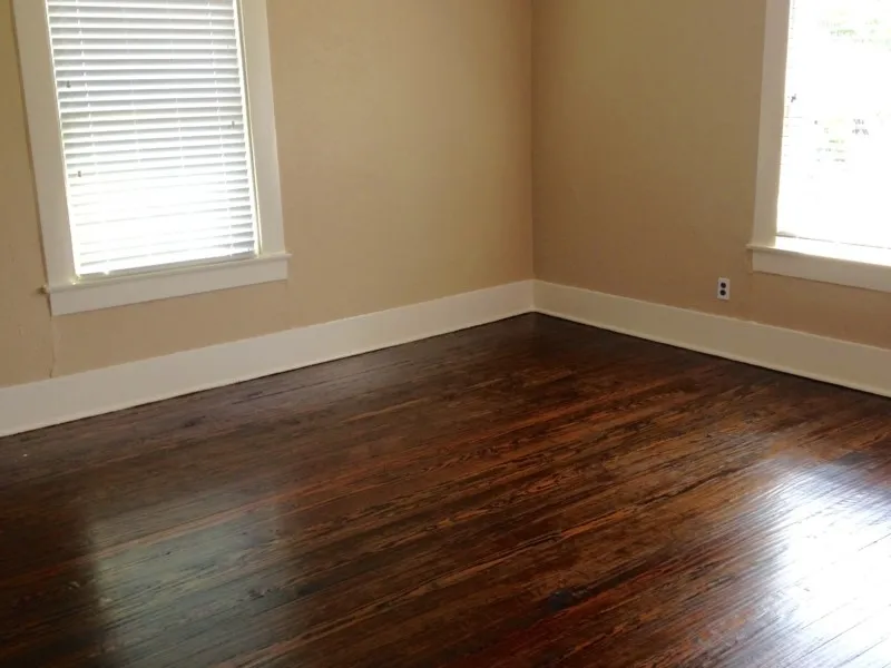 Empty room with dark hardwood / wood-style flooring