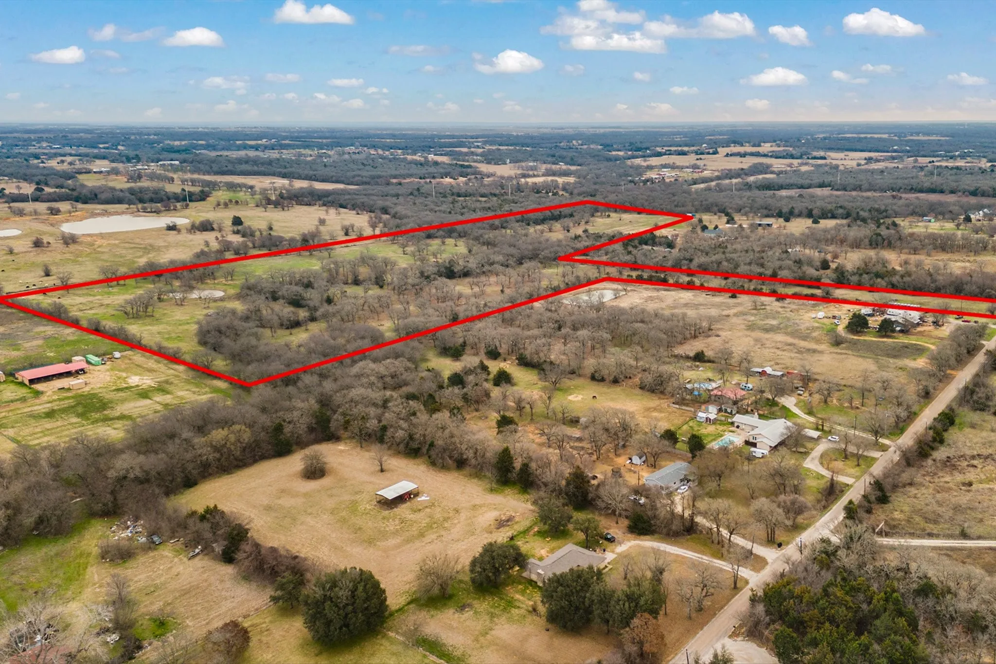 Birds eye view of property with a rural view