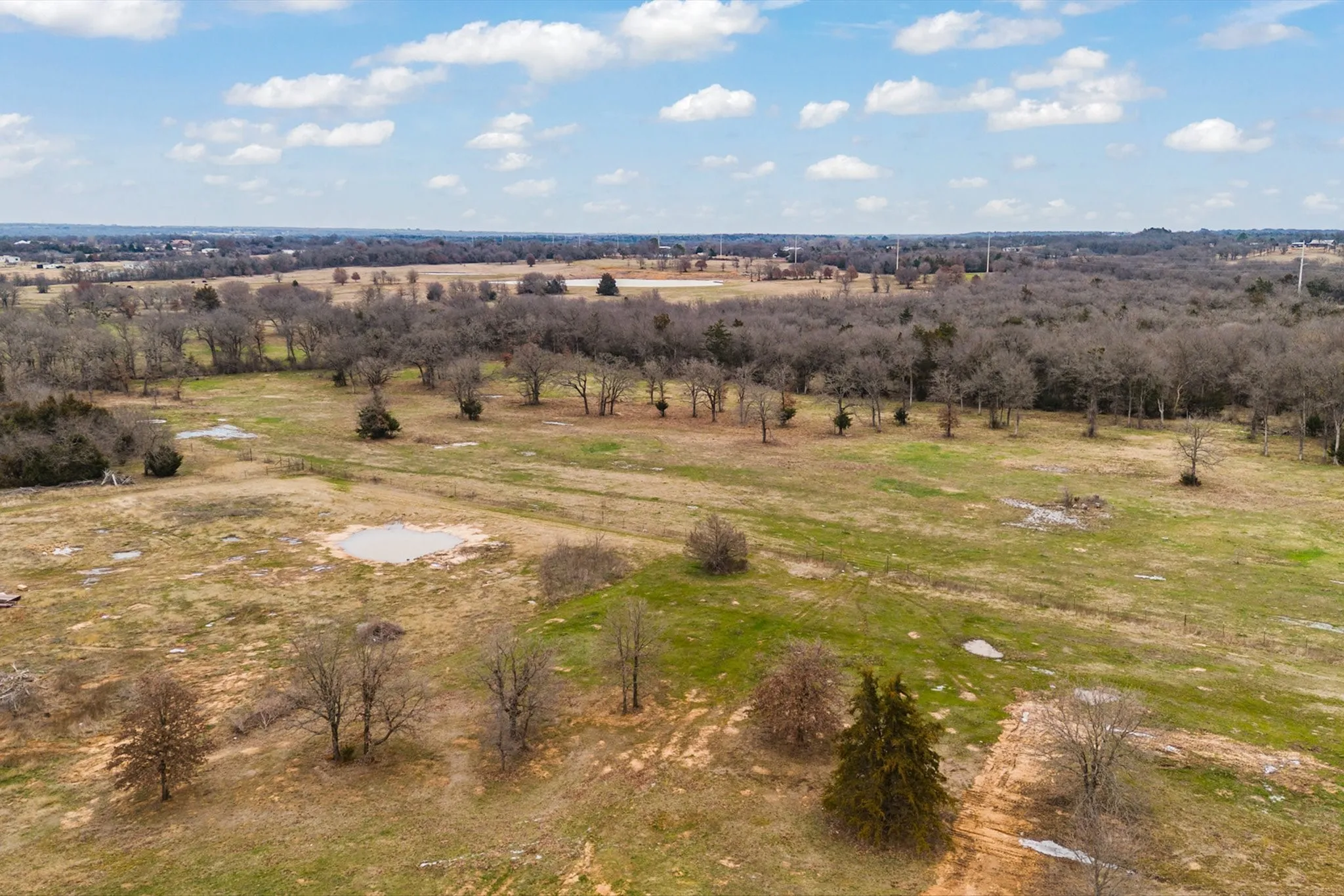 Birds eye view of property with a rural view