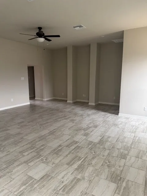 Unfurnished room featuring light hardwood / wood-style flooring and ceiling fan