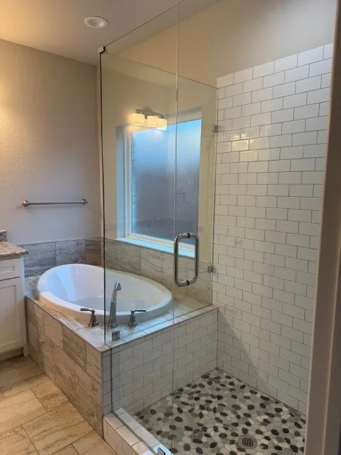 Bathroom with vanity and independent shower and bath