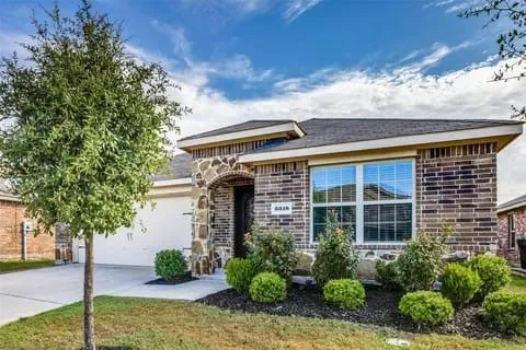 View of front of property featuring a garage