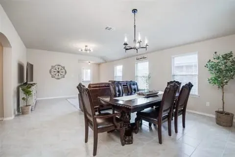 Dining room with a notable chandelier
