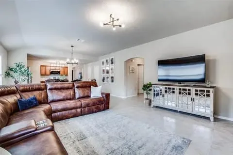 Living room featuring a notable chandelier