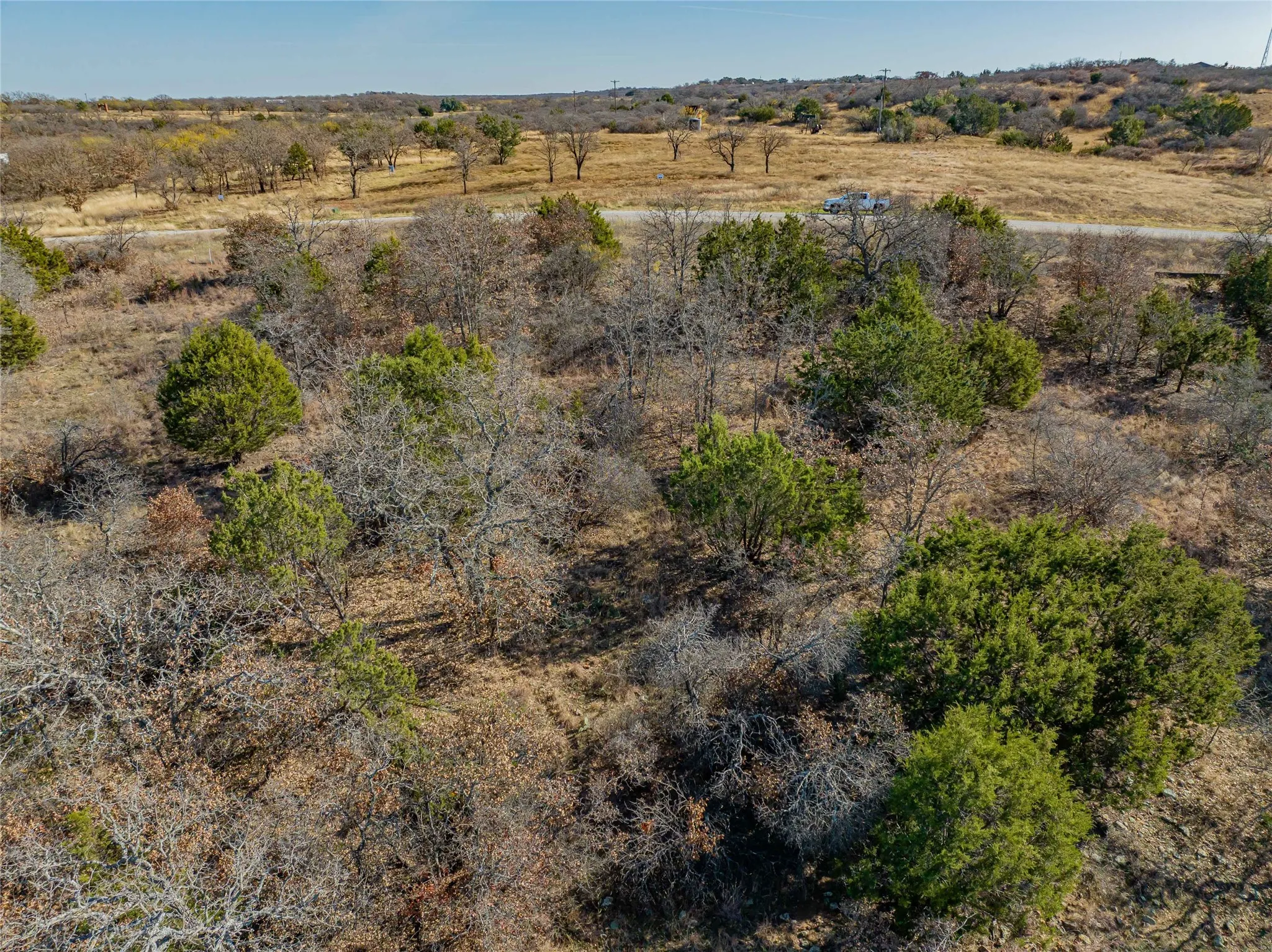 Birds eye view of property with a rural view