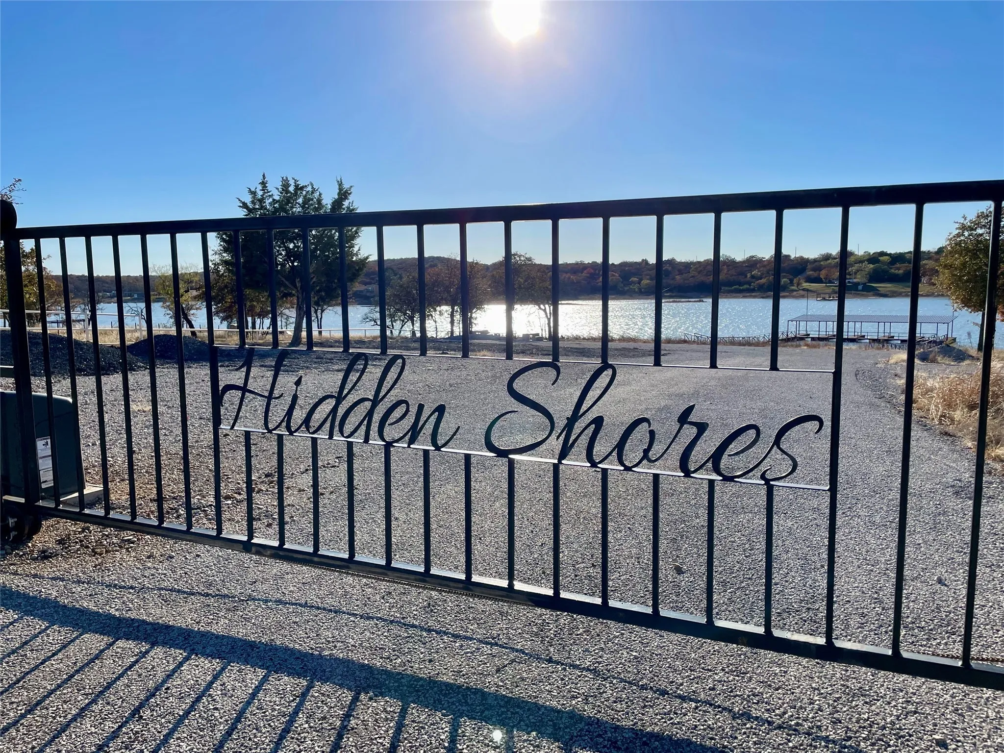 View of gate with a water view
