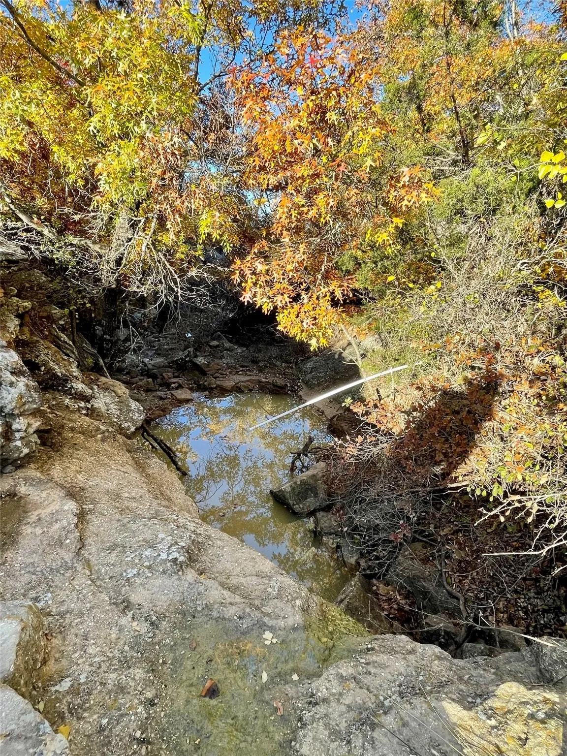 View of landscape featuring seasonal creek