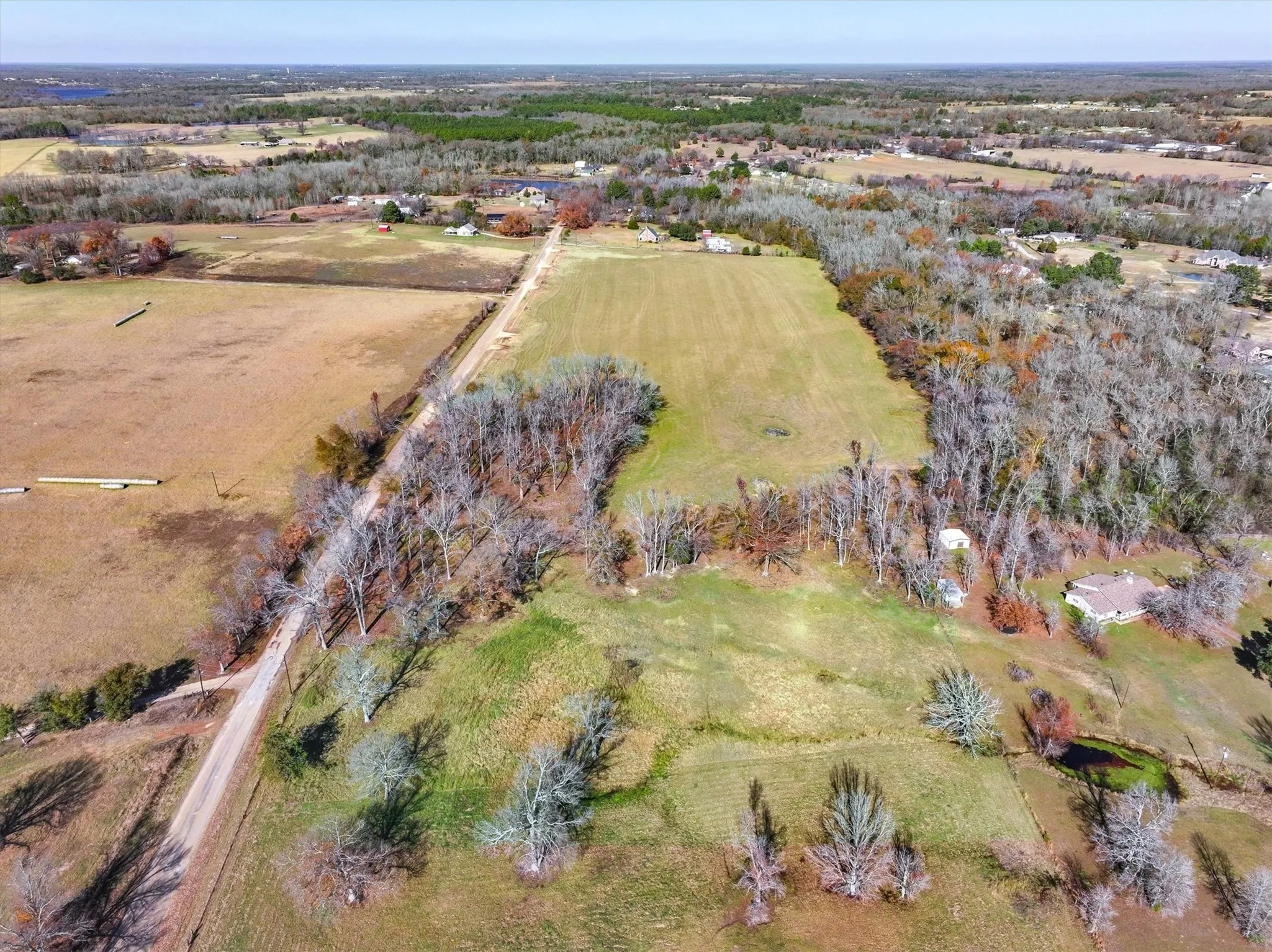 Birds eye view of property with a rural view