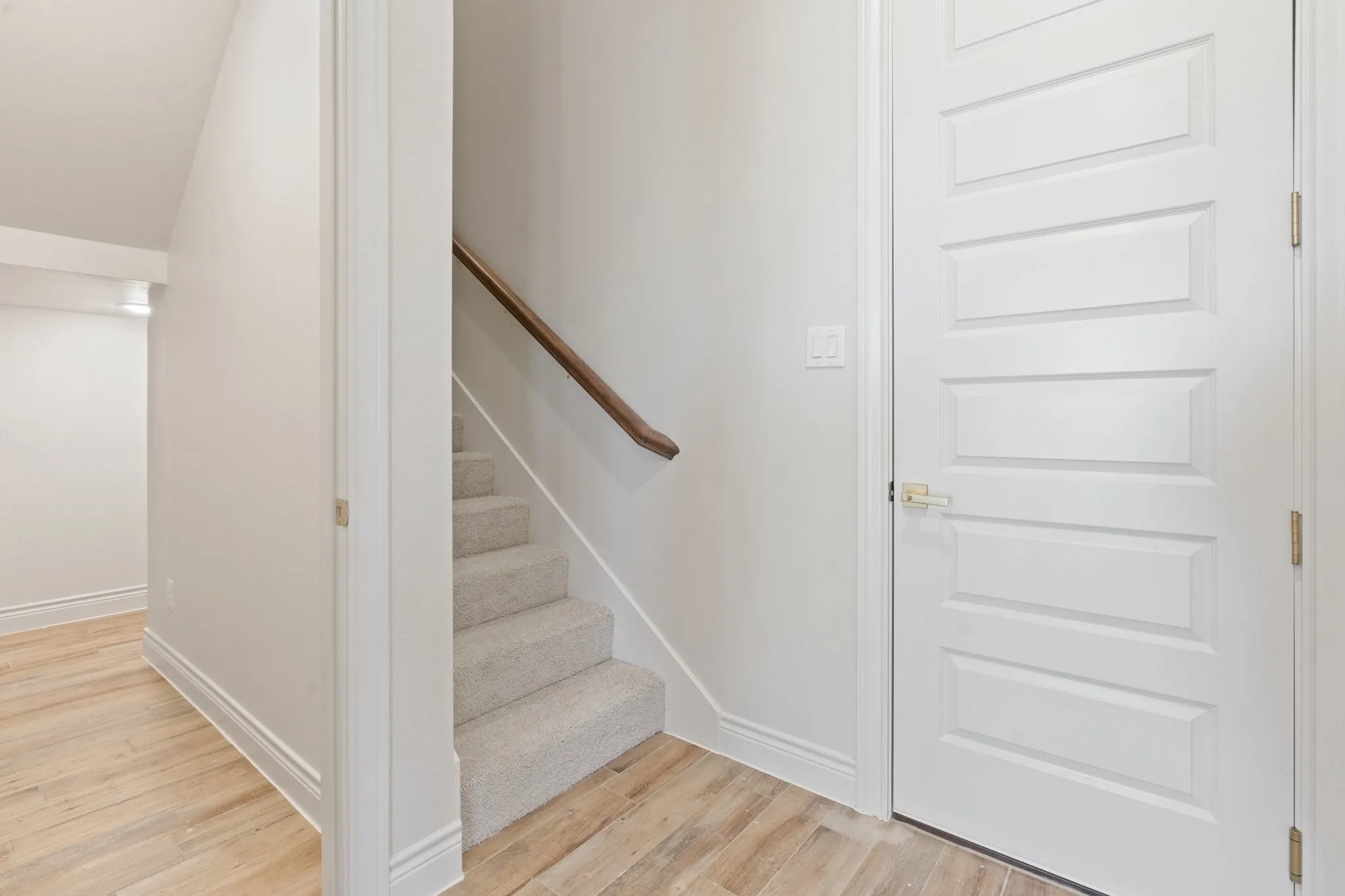 Stairs to the Bonus Room with Full Bathroom--Door from the 3 Car Garage.