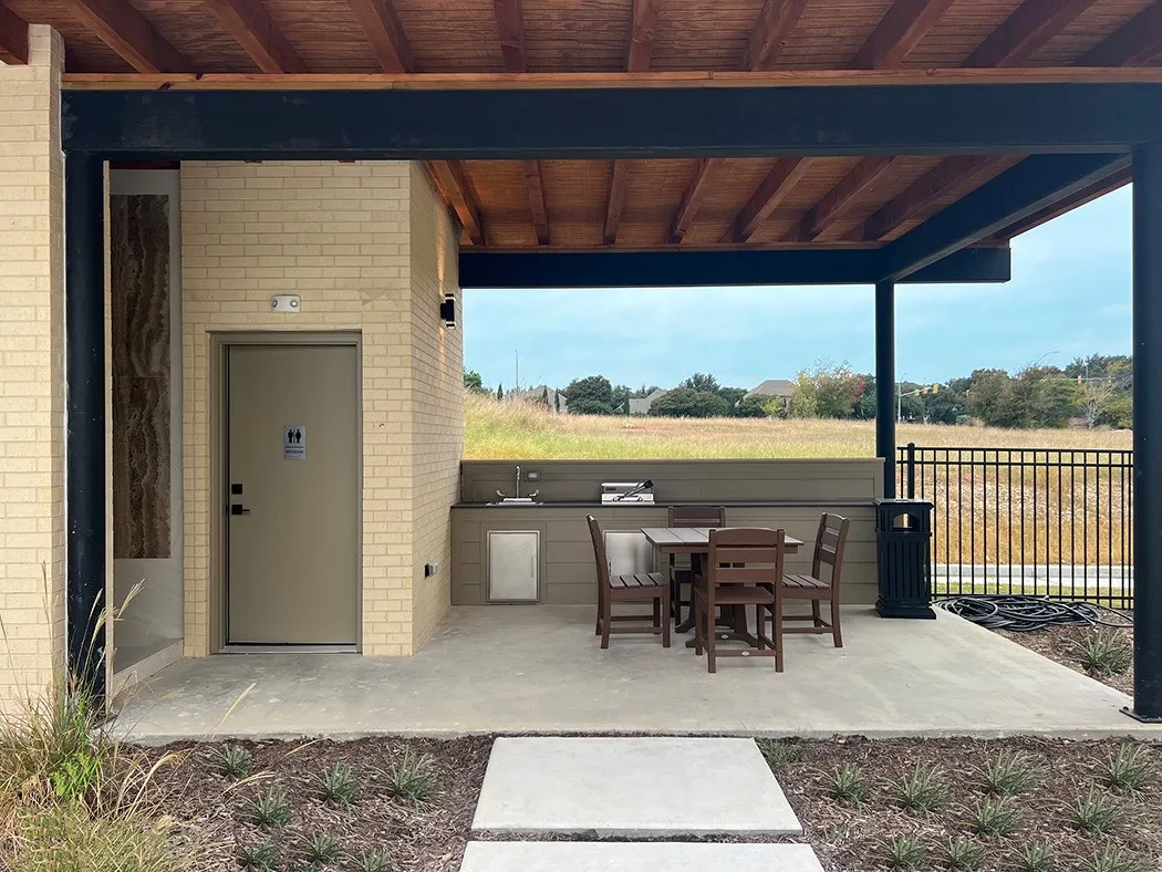 View of patio with a rural view and exterior kitchen