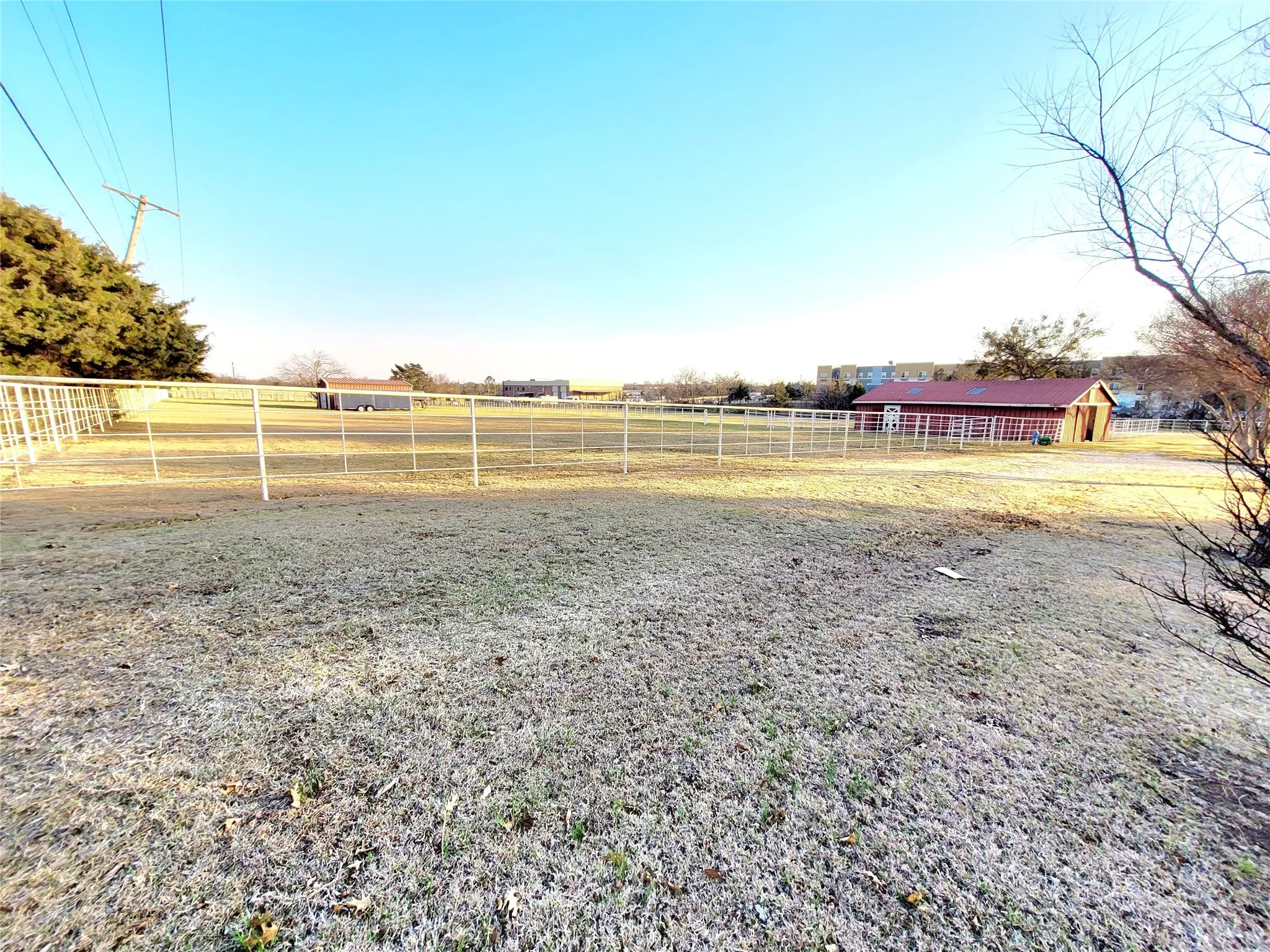 View of yard with a rural view and an outdoor structure