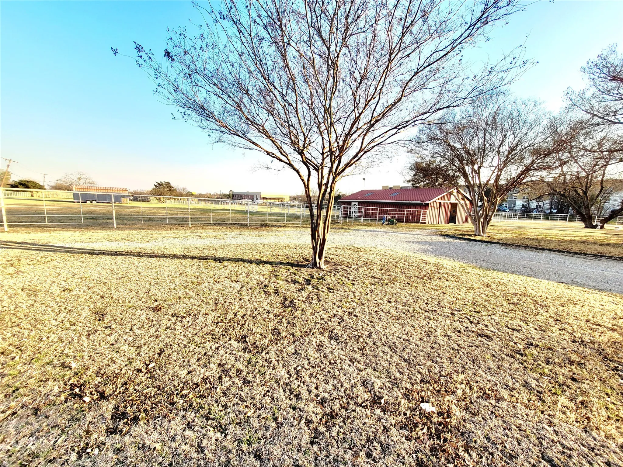 View of yard featuring a rural view and an outdoor structure
