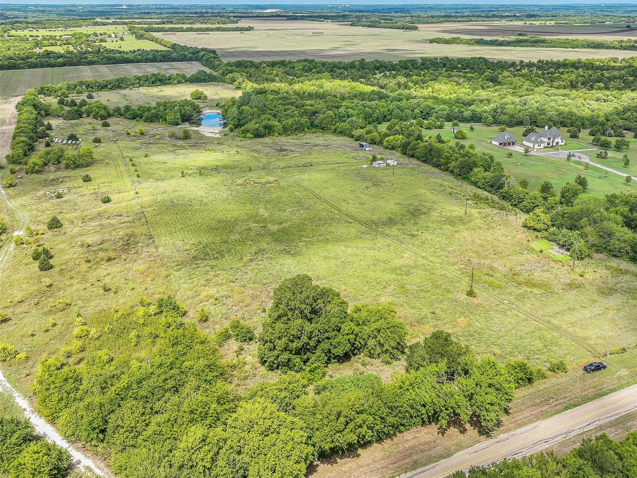Aerial view from FM 2729 towards back of property