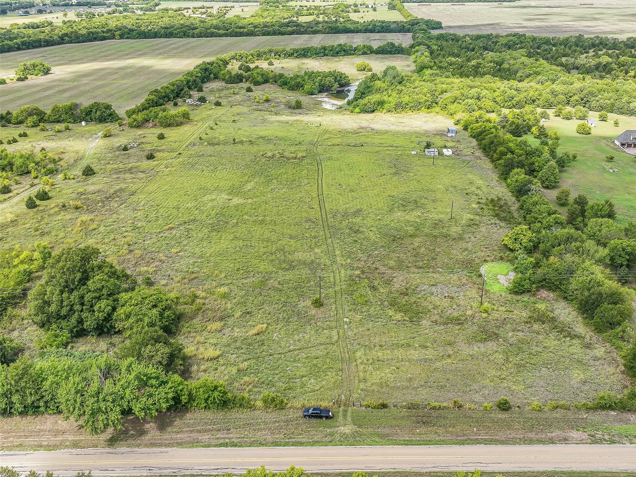 From Road all the way to back of property past second clearing beyond pond