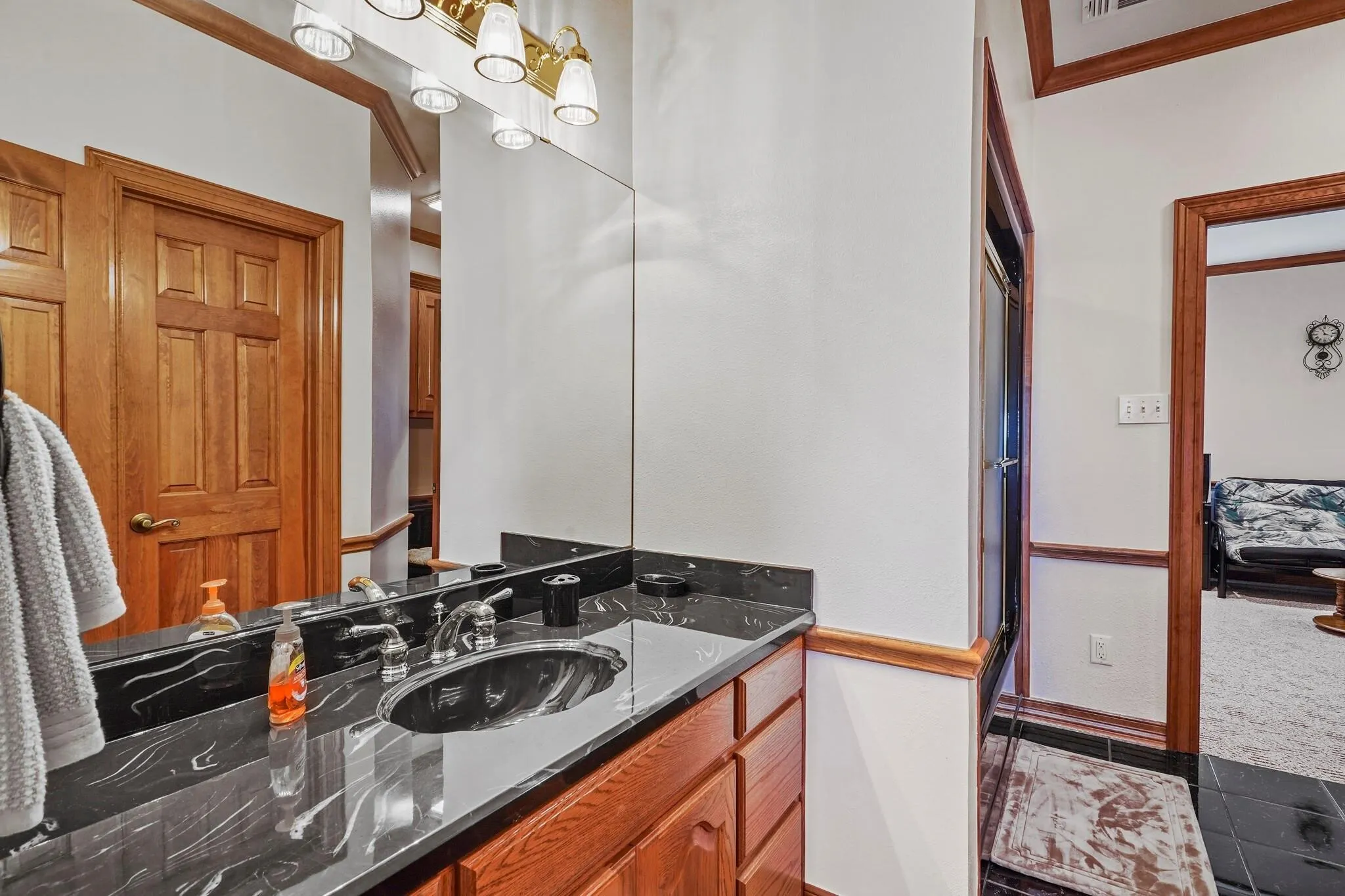 Bathroom with tile patterned flooring and vanity