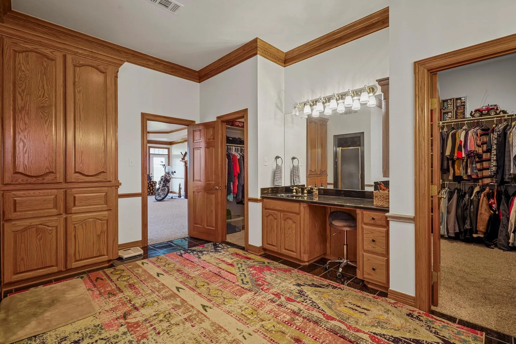 Bathroom featuring vanity and crown molding