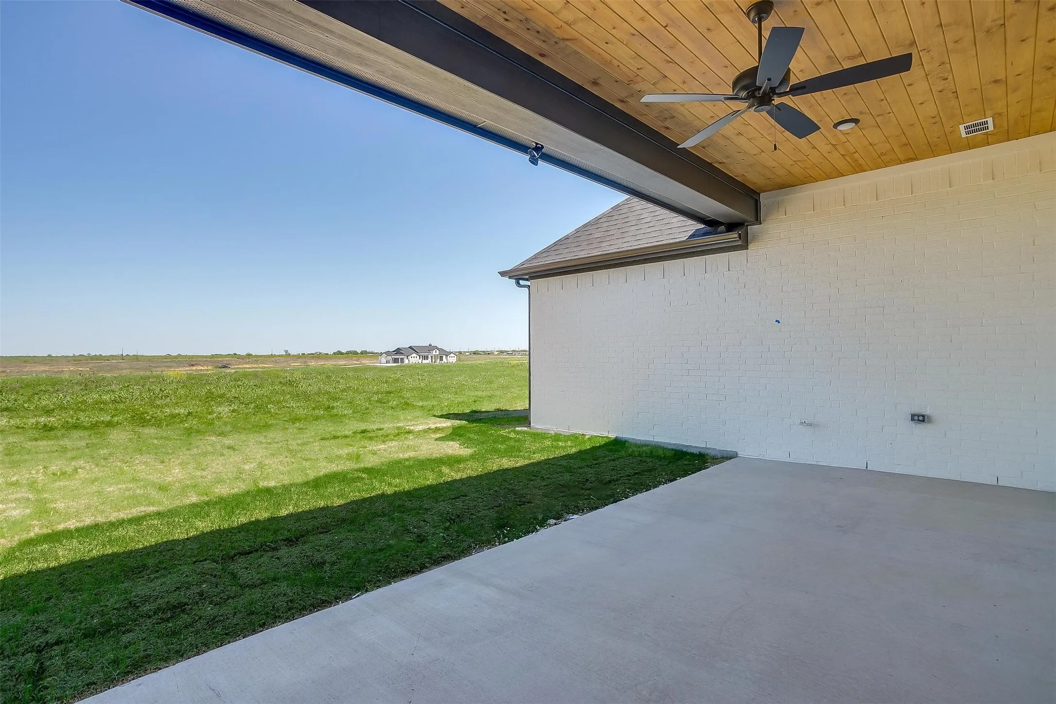 View of yard with a patio area, visible vents, and a ceiling fan