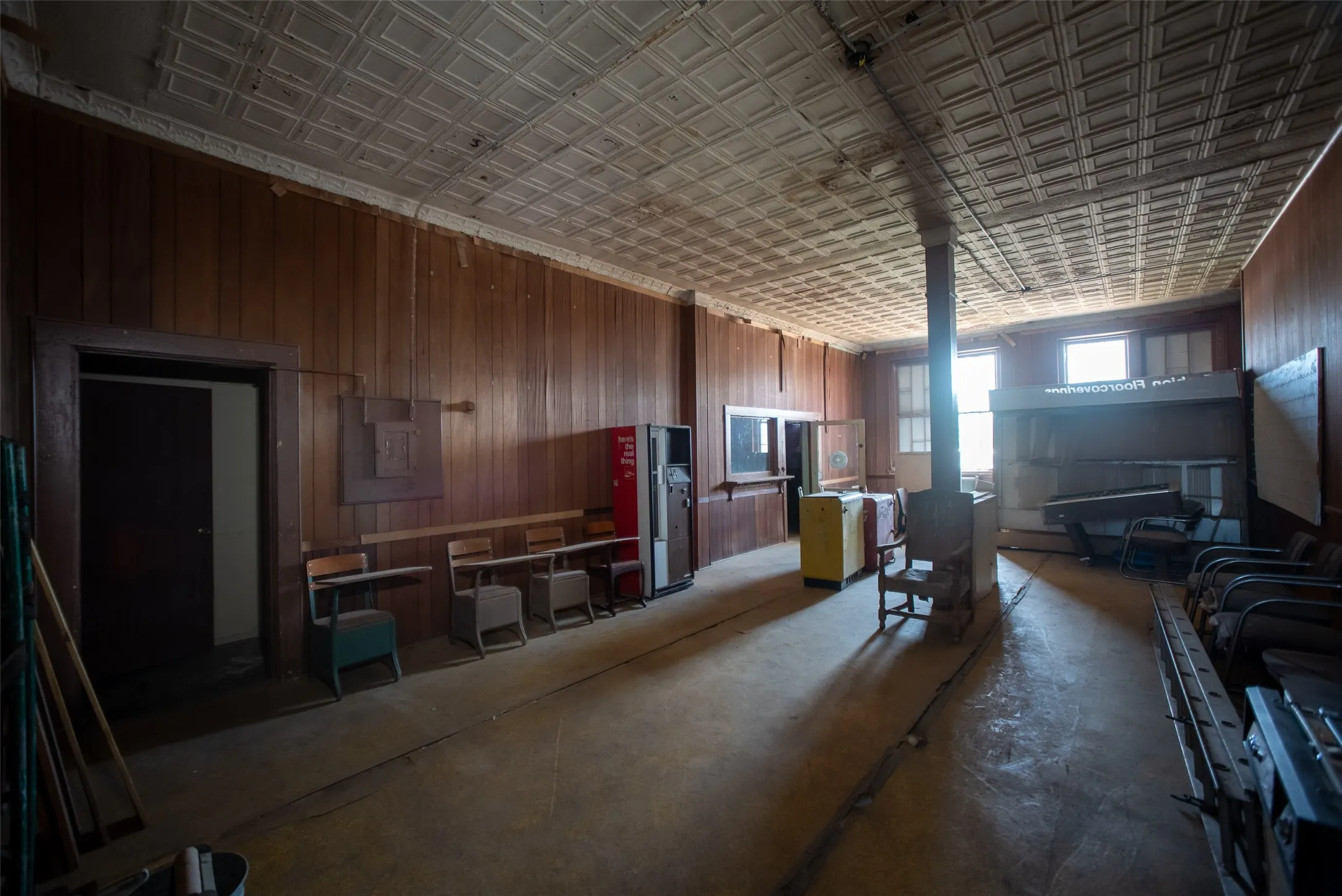 Miscellaneous room with electric panel and concrete flooring