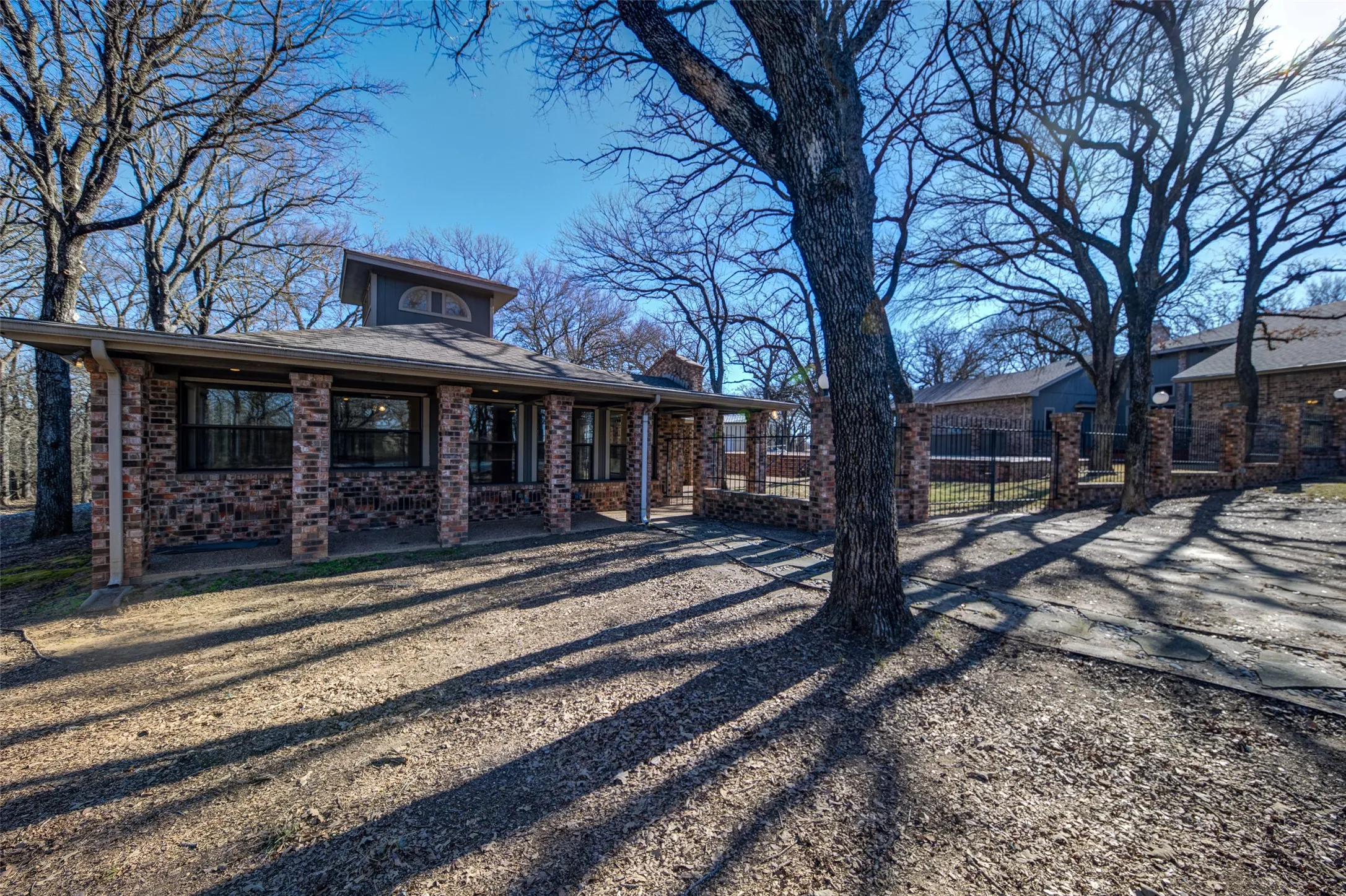 Rear view of house featuring brick siding