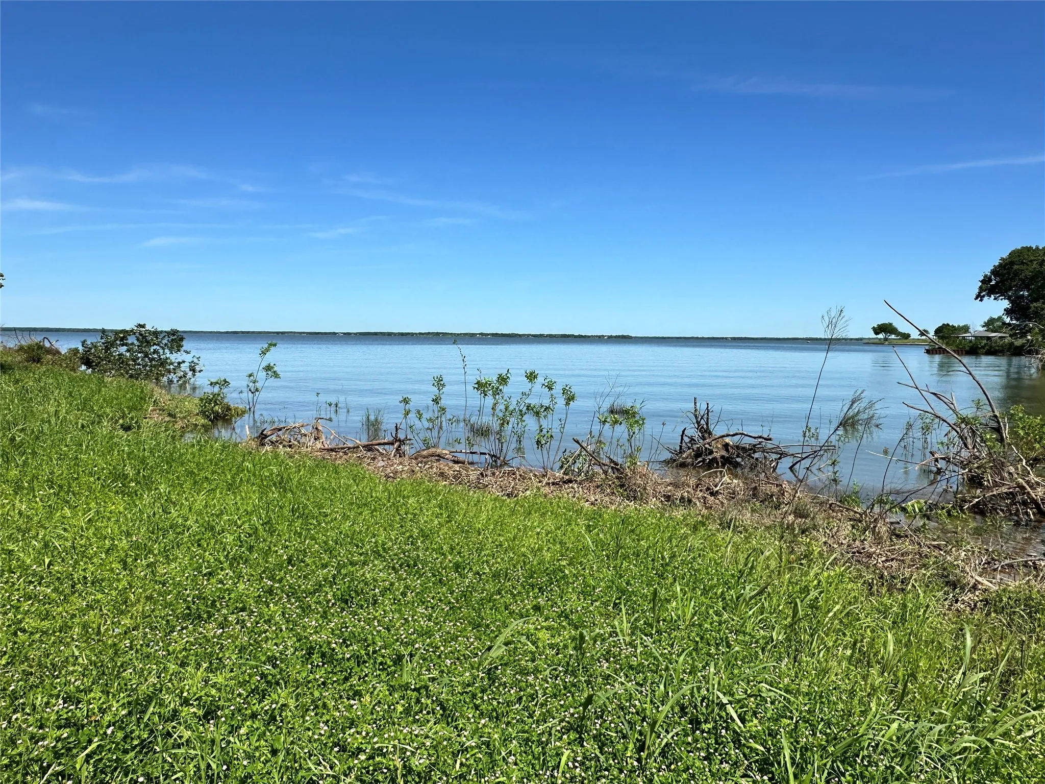 Wide lake views from the waterfront homesite.