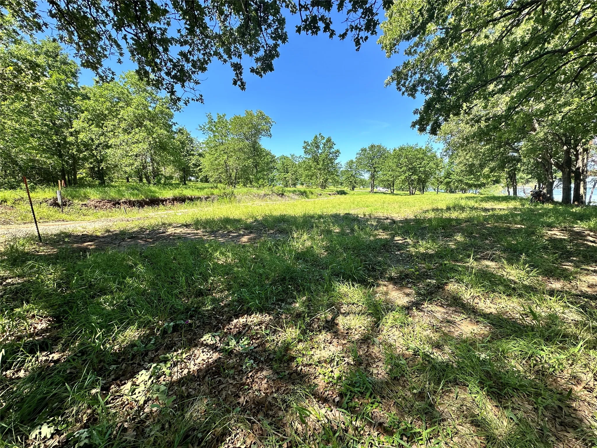 Cleared homesite offers room for your dream lake house.