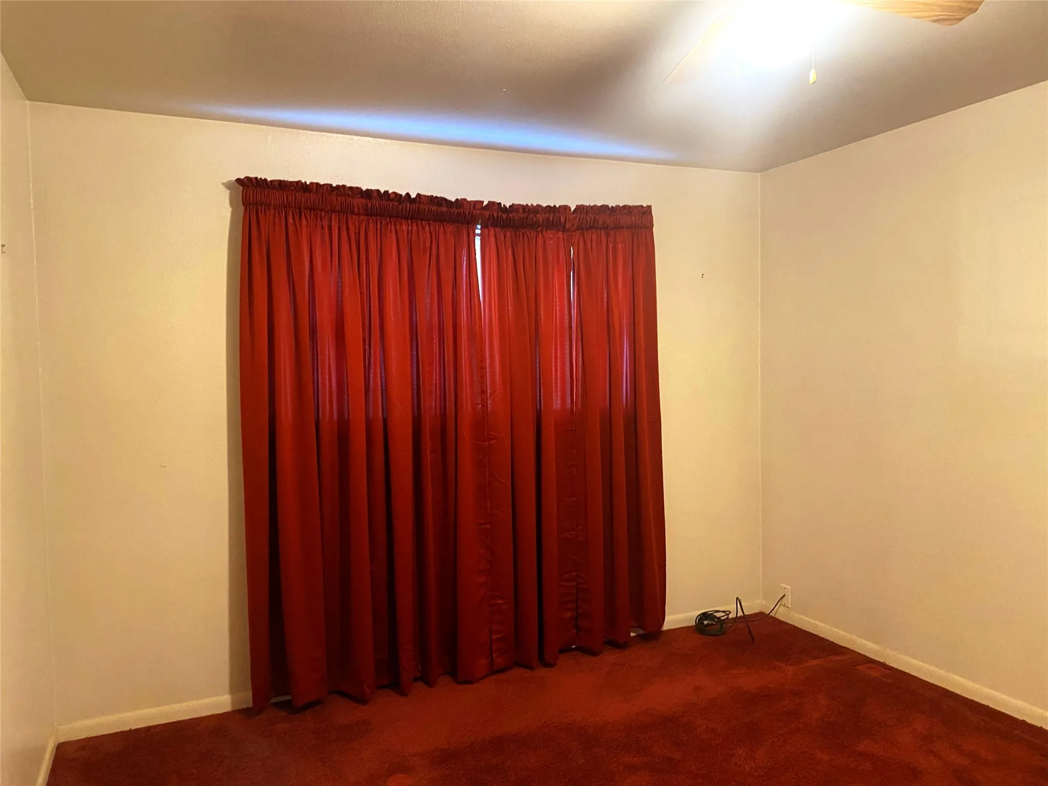 Unfurnished room with carpet floors