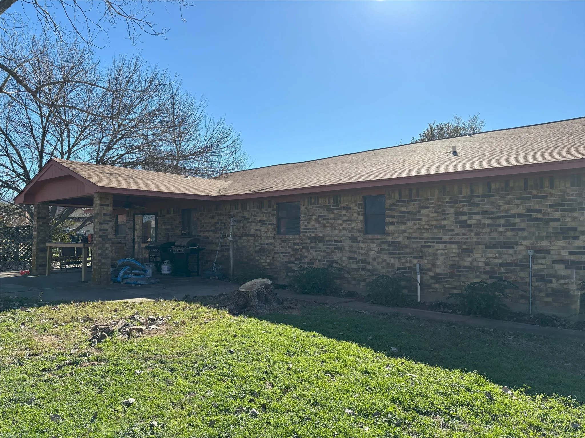 Back of property with a patio area and a yard