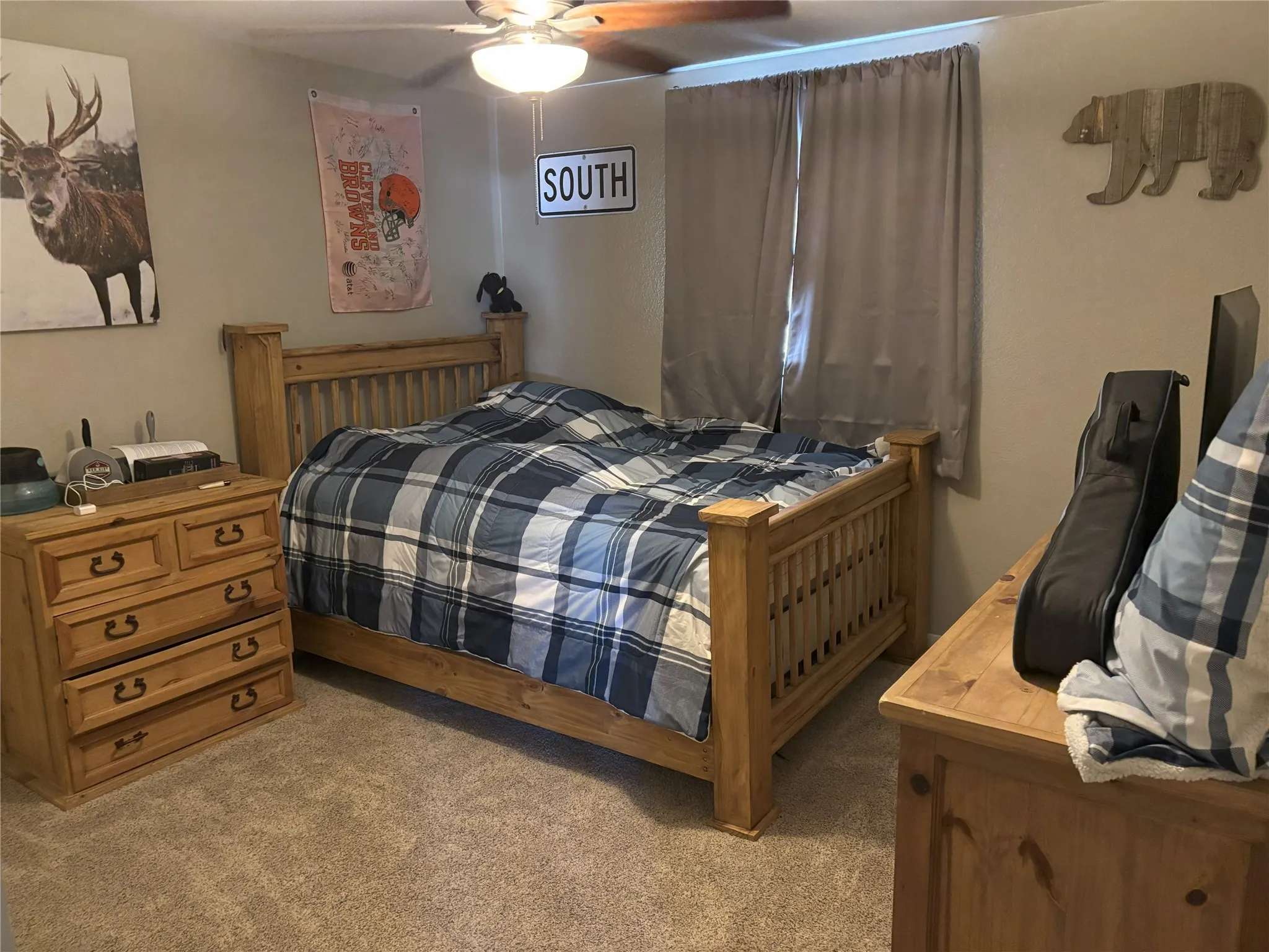 Carpeted bedroom with ceiling fan