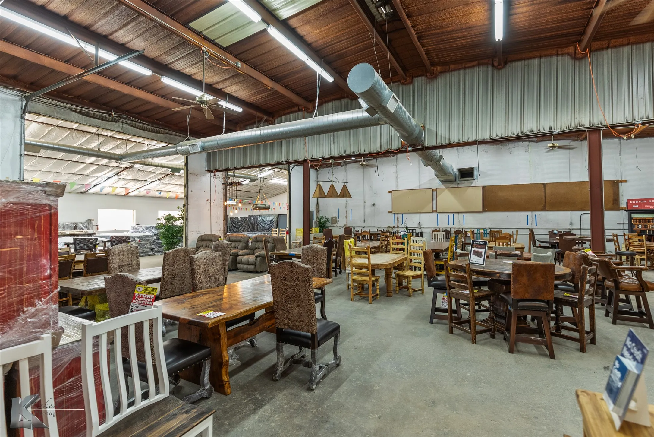Dining space with concrete flooring and ceiling fan