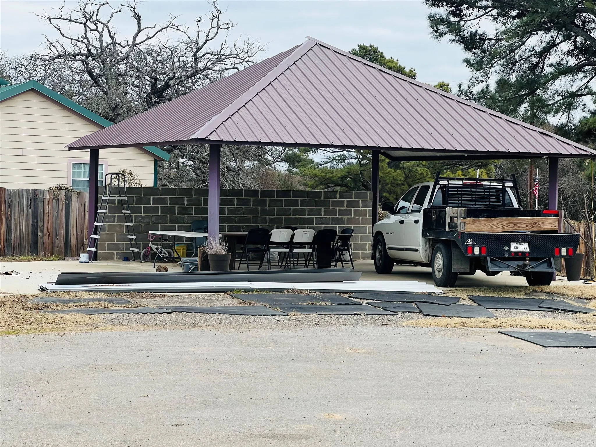 View of car parking featuring a gazebo