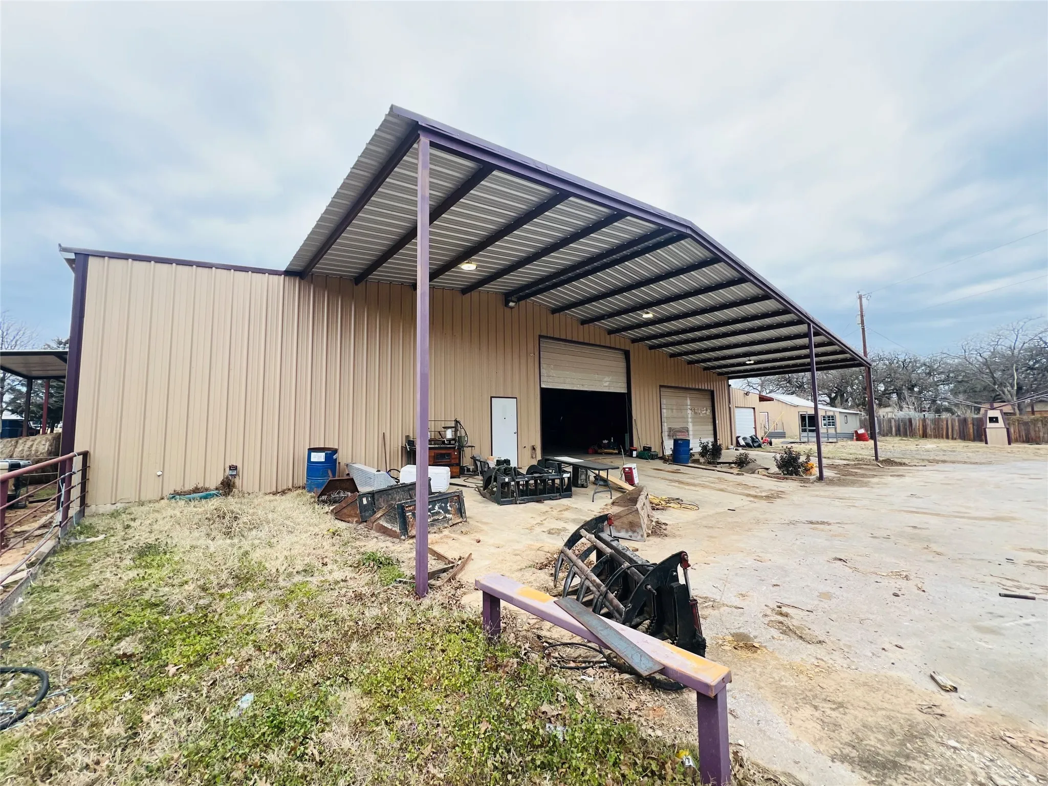 View of parking with a garage