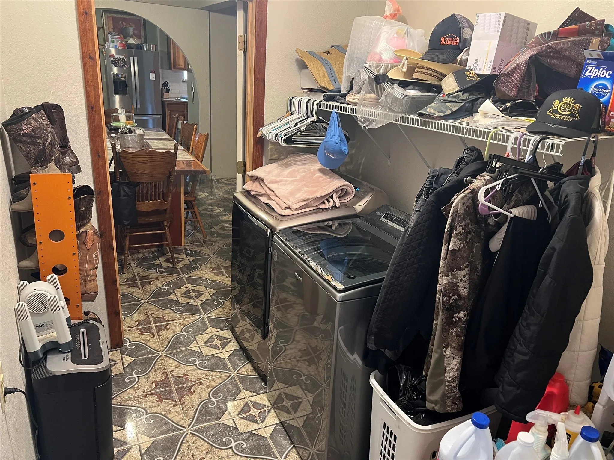 Clothes washing area featuring washing machine and dryer